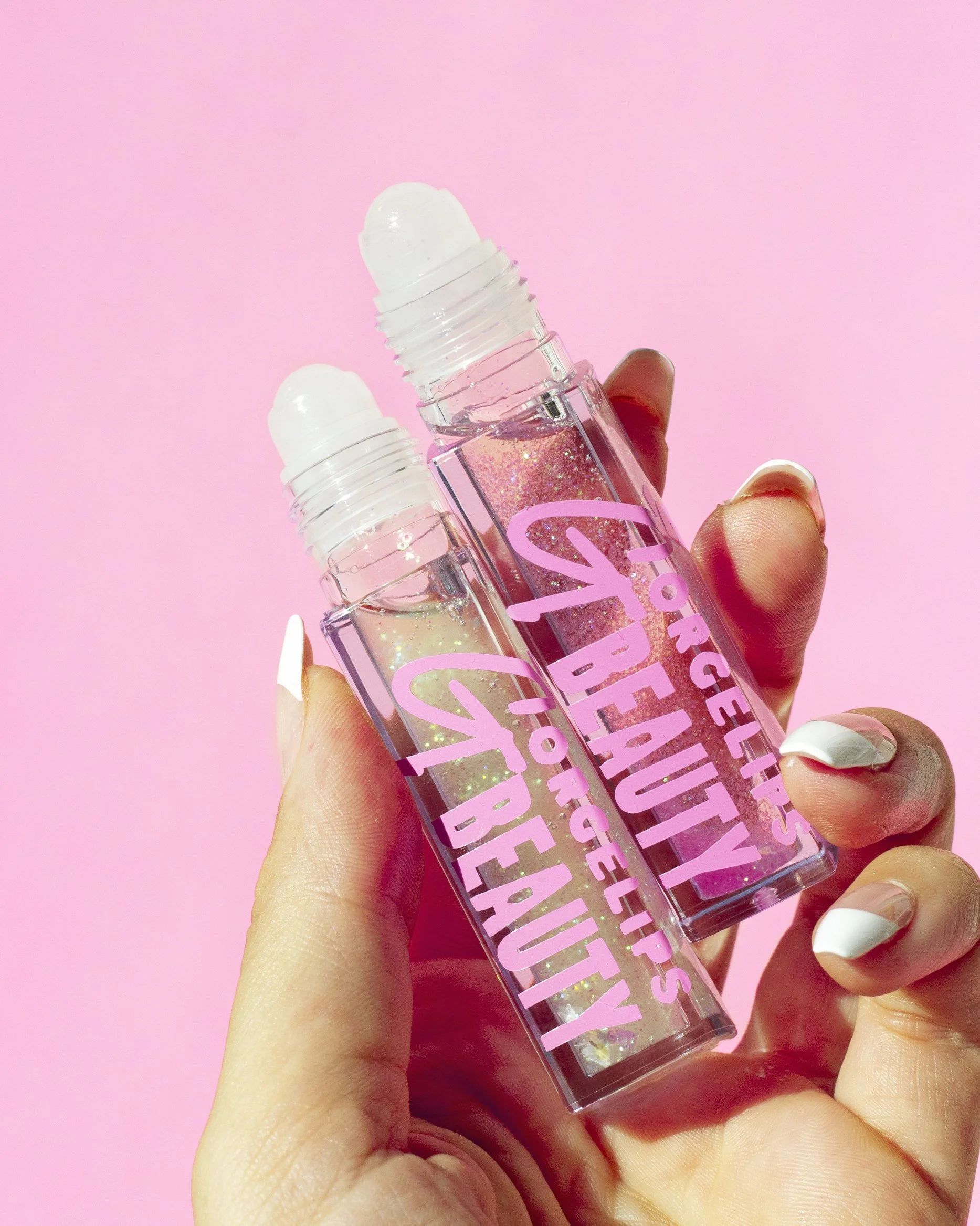 lip oils on pink.jpg