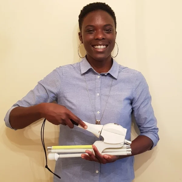 Nia Simpson with a prototype of the Compact Cane