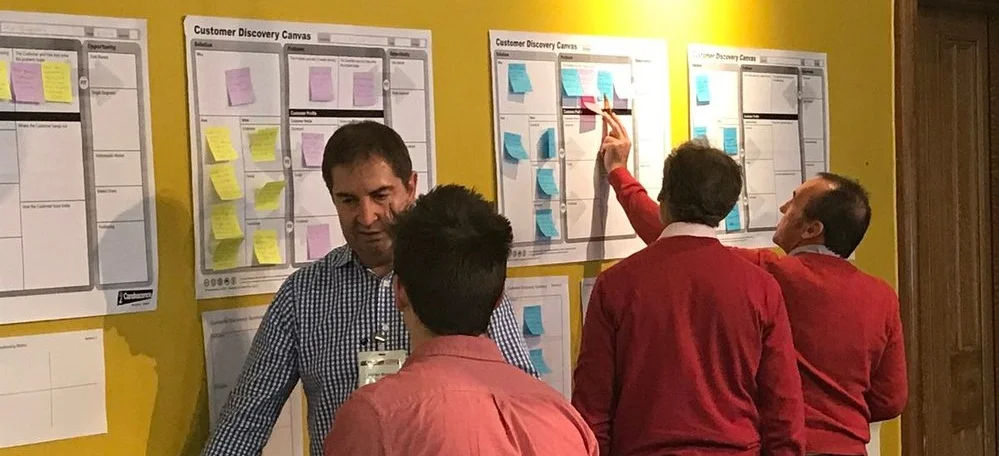 Entrepreneurs%2Bworking%2Bon%2Bideas.jpg