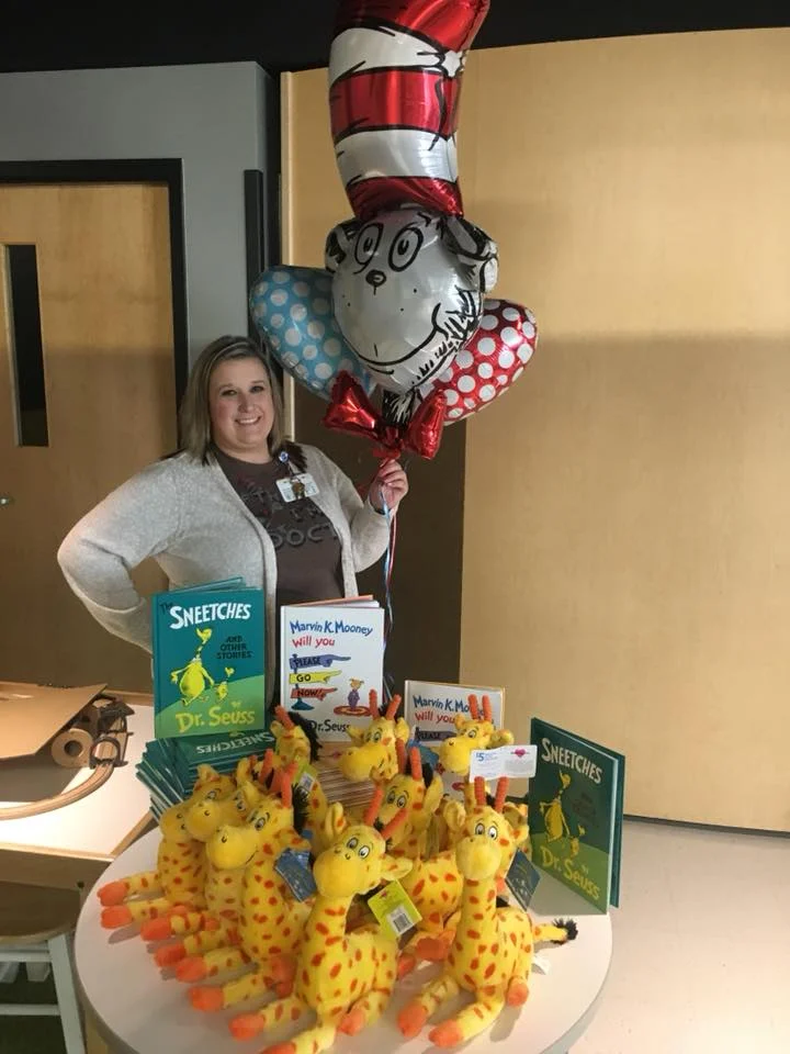 Donna Lewis, School Programs Coordinator, during a Dr. Seuss week reading event inside The Zone.