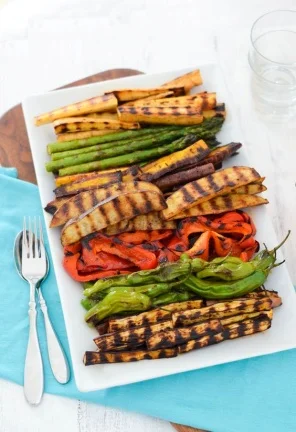 GRILLED VEGGIE HORS D’OEUVRE serves 12 prep 5 mins cook 15 mins total 20 mins Ingredients vegetables, cut lengthwise in 3-6" pieces. (Any combination of zucchini, bell peppers, onions, potatoes, asparagus, hatch chiles, parsnips, carrots, or eggplant can be used.) · · seasoning mix (below) · olive oil Seasoning Mix · 3 teaspoons salt · 1 teaspoon fresh black pepper · 1/2 teaspoon onion powder · 1 teaspoon smoked paprika · 1/2 teaspoon paprika · 1 teaspoon dried thyme Instructions 1. Preheat grill pan over medium heat. 2. Toss vegetables with olive oil and seasoning mix with cut vegetables - roughly 1 Cup of vegetables with 1 tablespoon olive oil and 1 heaping teaspoon seasoning mix. (potatoes will require extra olive oil and a sprinkle of salt to flavour). 3. Spray grill pan with non-stick spray. 4. Place vegetables on grill pan perpendicular to grill lines. Flip after 4-6 minutes (check for grill marks). 5. Cook other side for 4-6 minutes - check for doneness. Vegetables should be tender but not squishy. 6. Remove to plate to cool. Refrigerate until 30 minutes before serving.