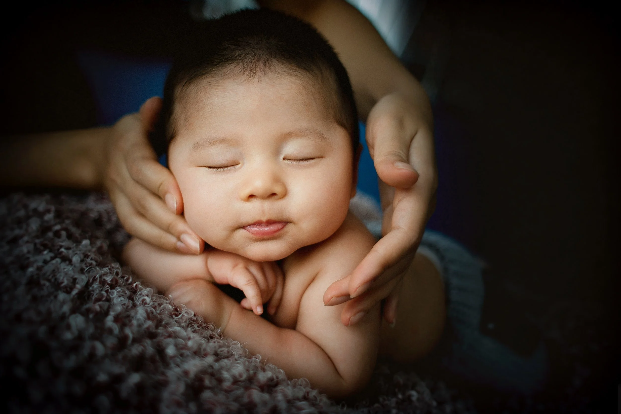 Mom helping baby during Tummy Time