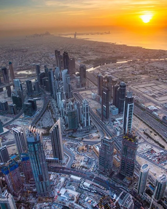 Sunset over Dubai, looking south over Atlantis Palm and Jumeirah Beach. Taken from the 152nd floor balcony of Burj Khalifa. 
__________________________________________________________________
Canon 5D Mk III + Canon 24-70mm at 24mm; 1/20sec at f/14; 