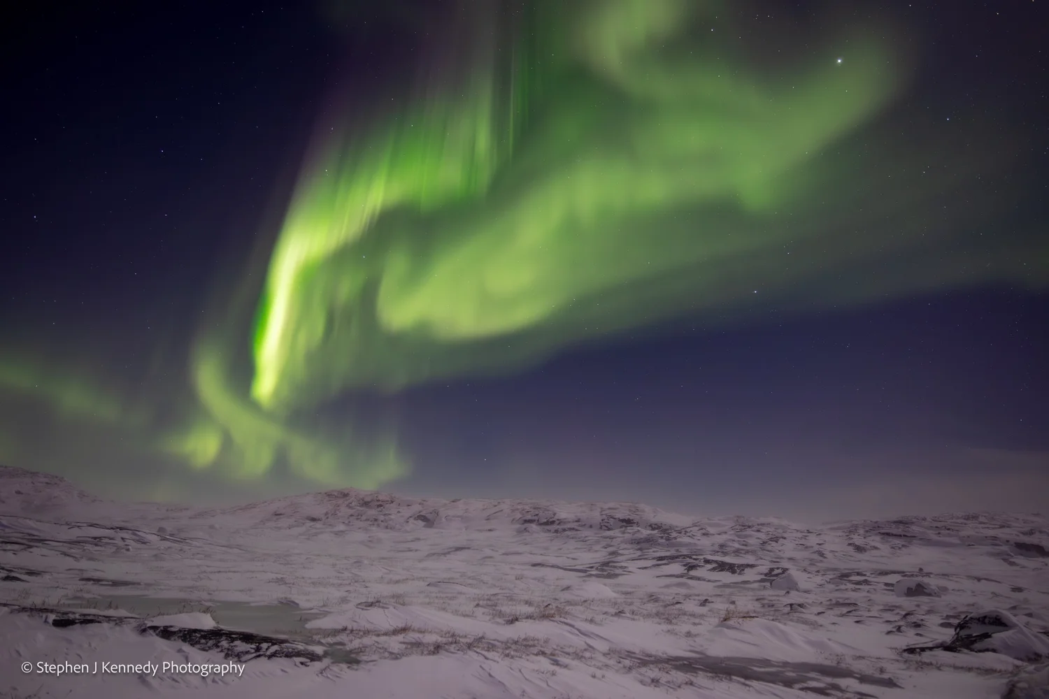 Ilulissat — aurora with horizontal snow gusts