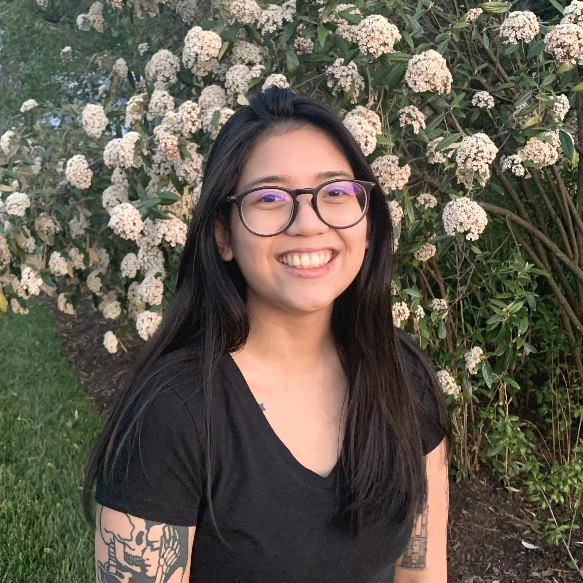 Heather with flowers behind her