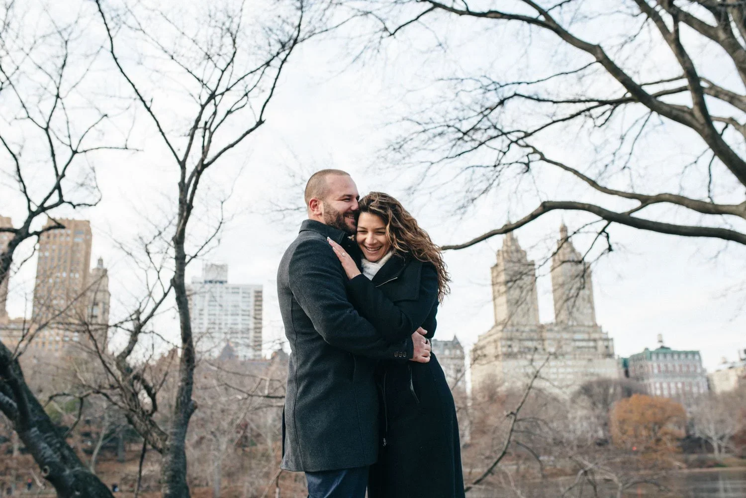 central-park-nyc-engagement-session-skyline-hug.jpg.webp