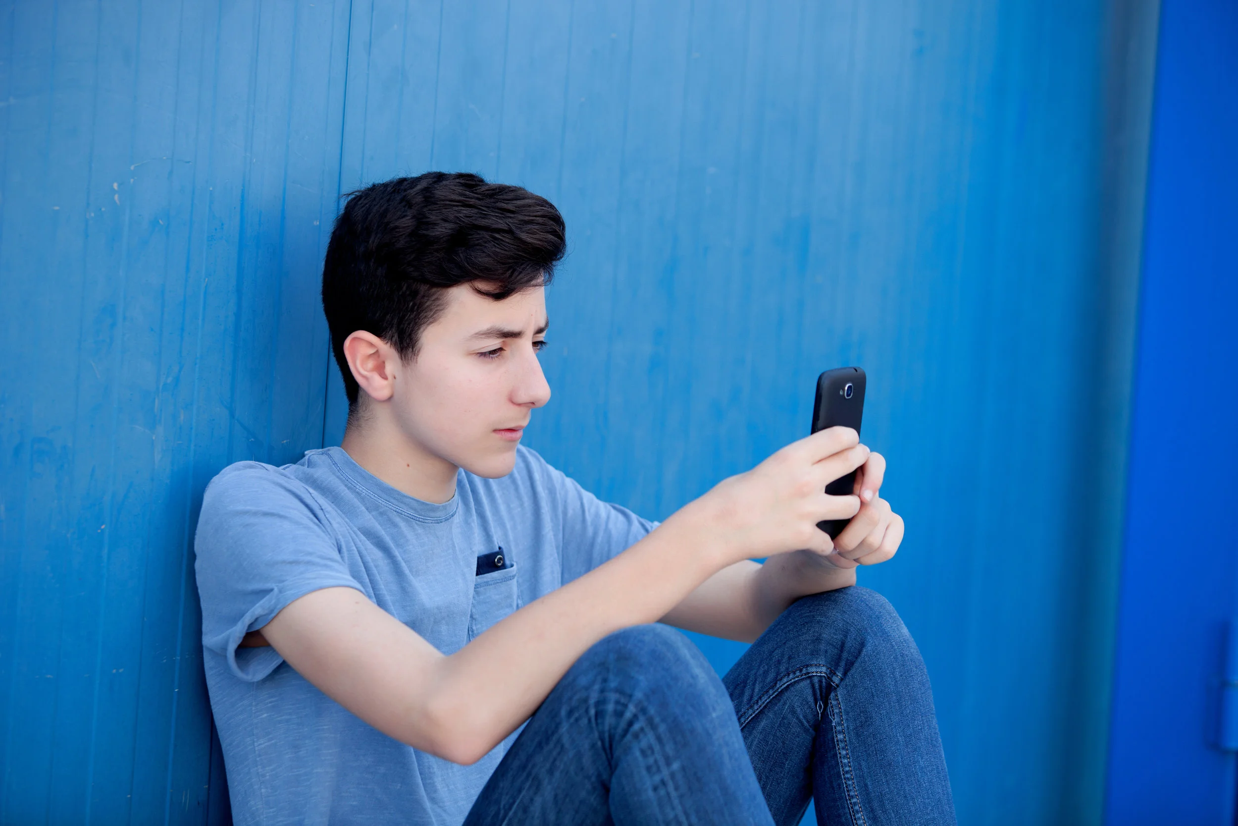 teenboywithphone.jpeg