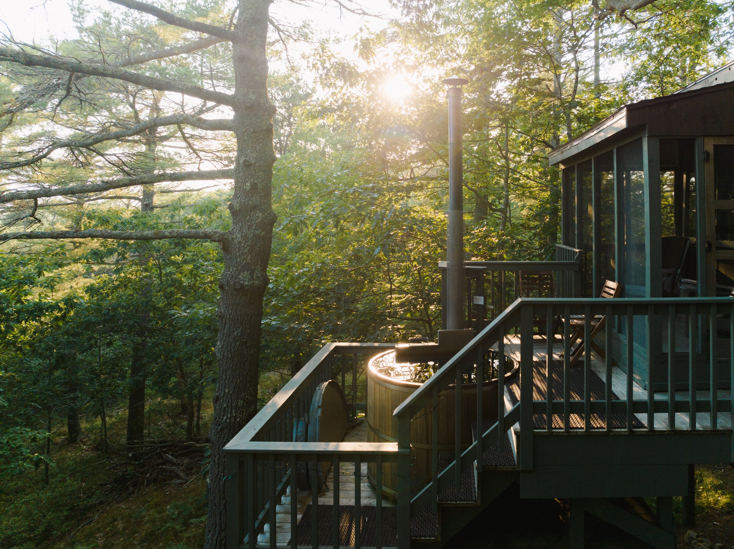 Treehouse SEguin Tree Dwellings Maine Hot tub Deck View