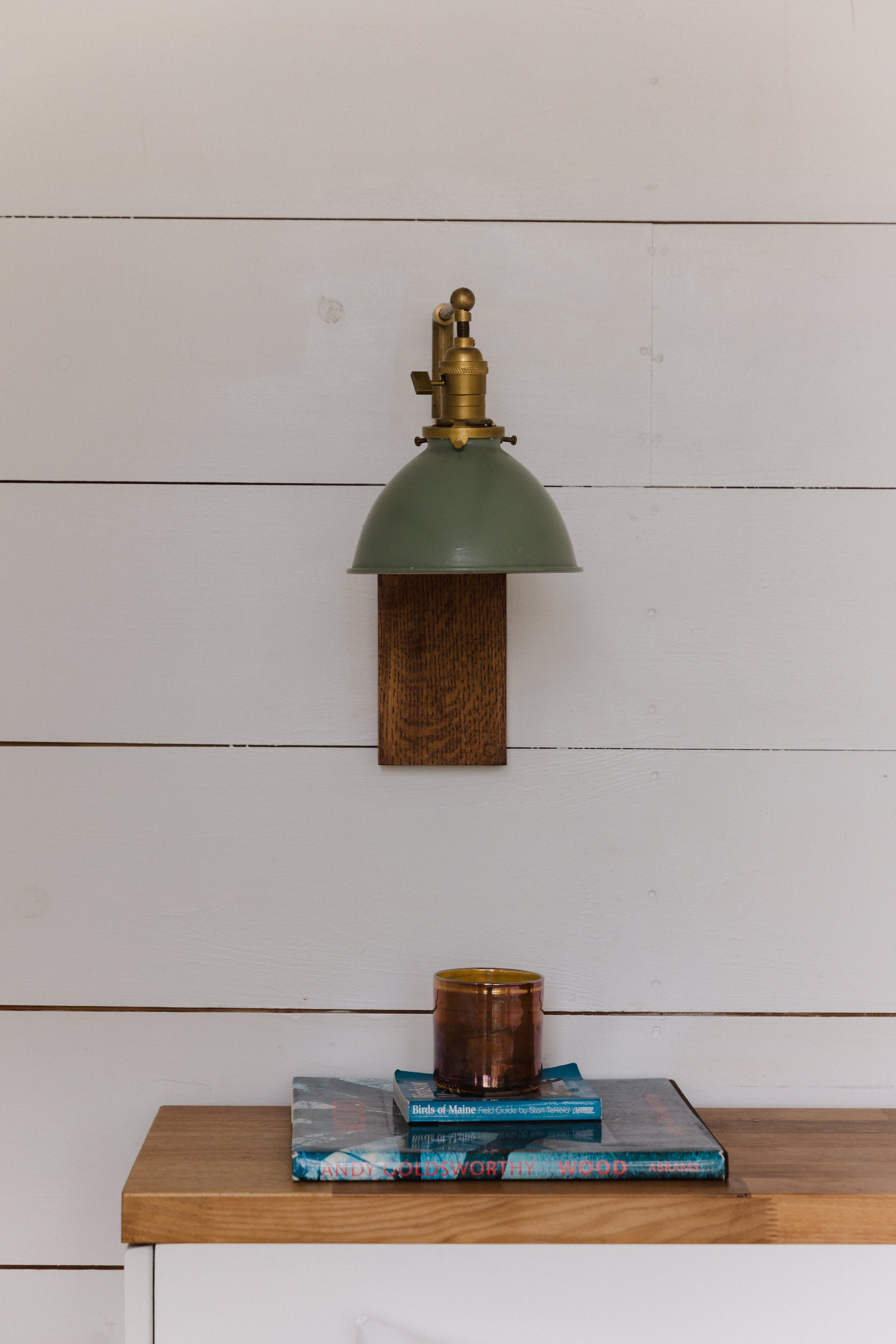 Treehouse bedroom sconces and books