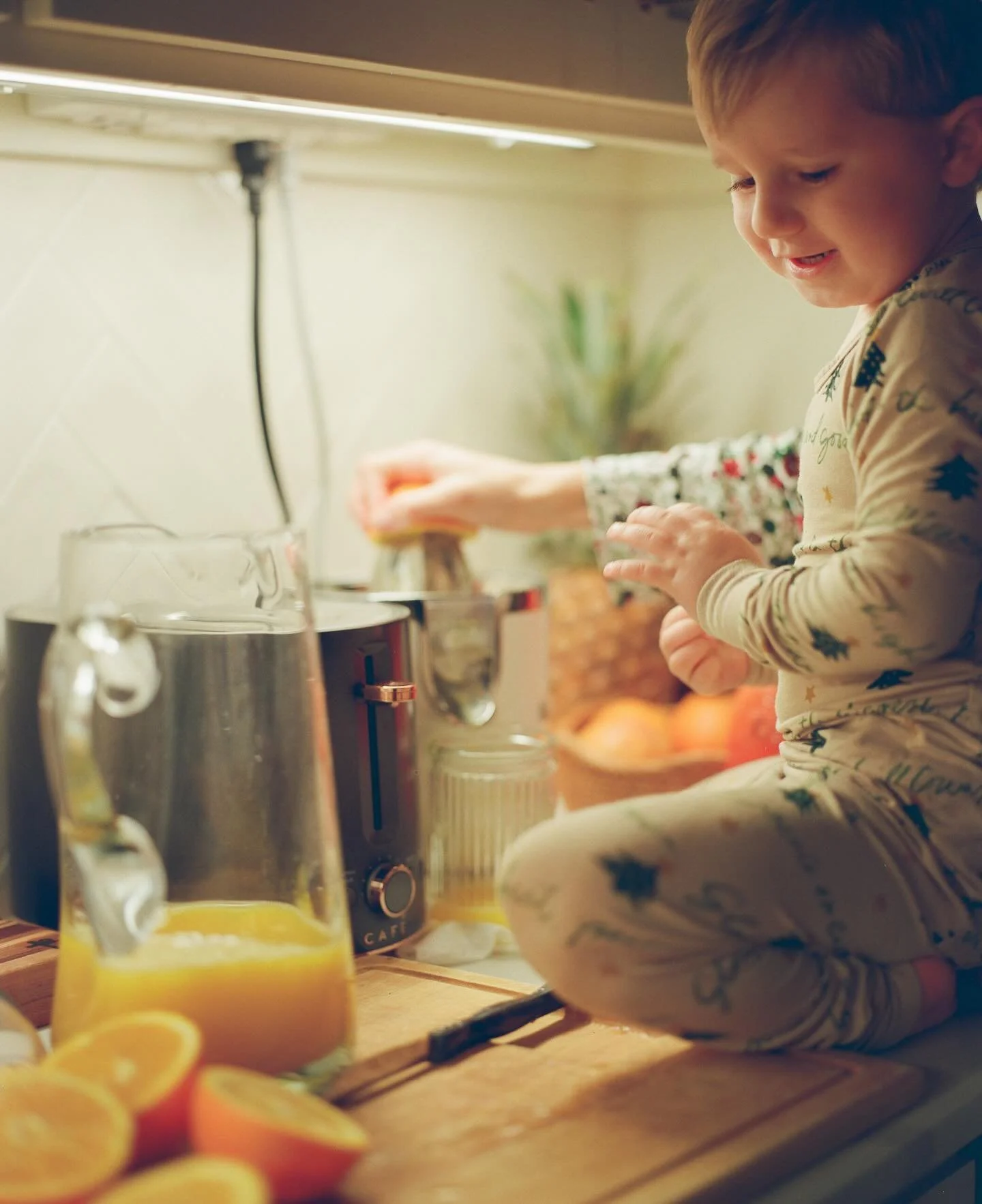 Had to make sure this precious one got a spot on the feed. Lincoln helping make fresh orange juice on Christmas morning, shot on 120mm film.