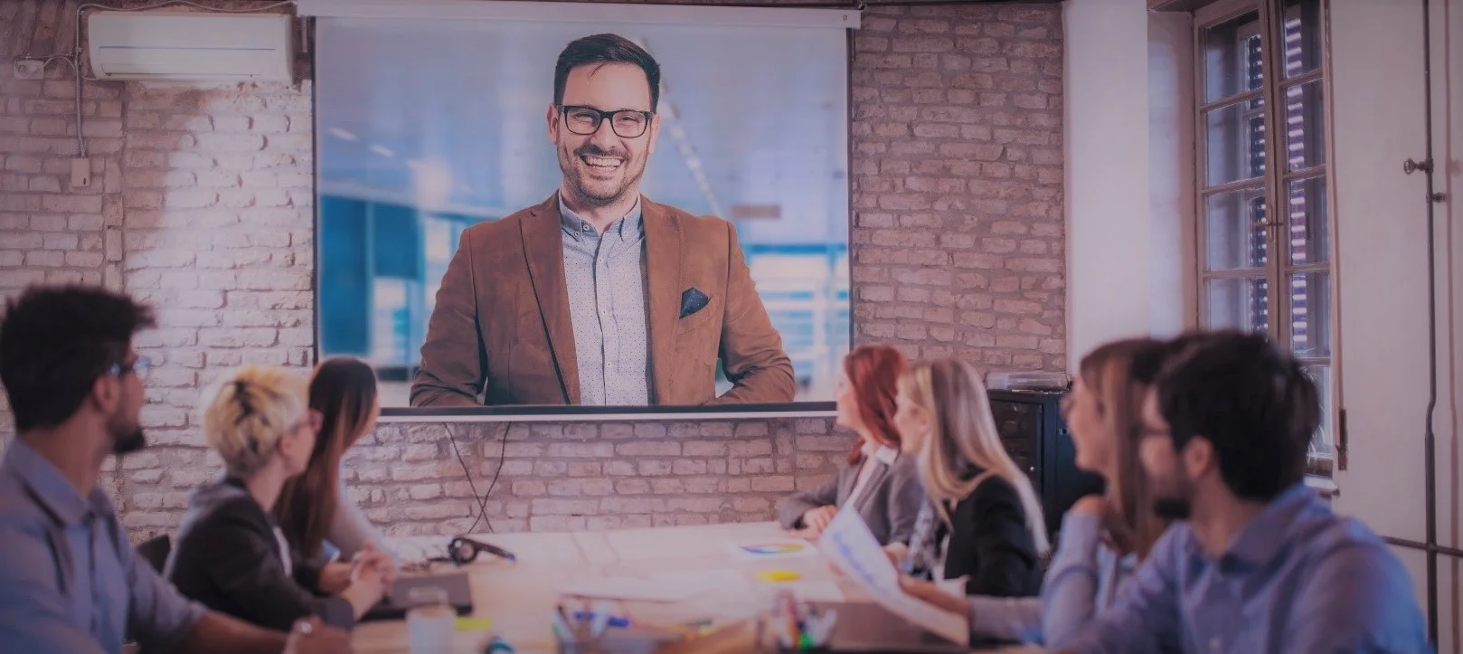 Smiling woman using unified communications