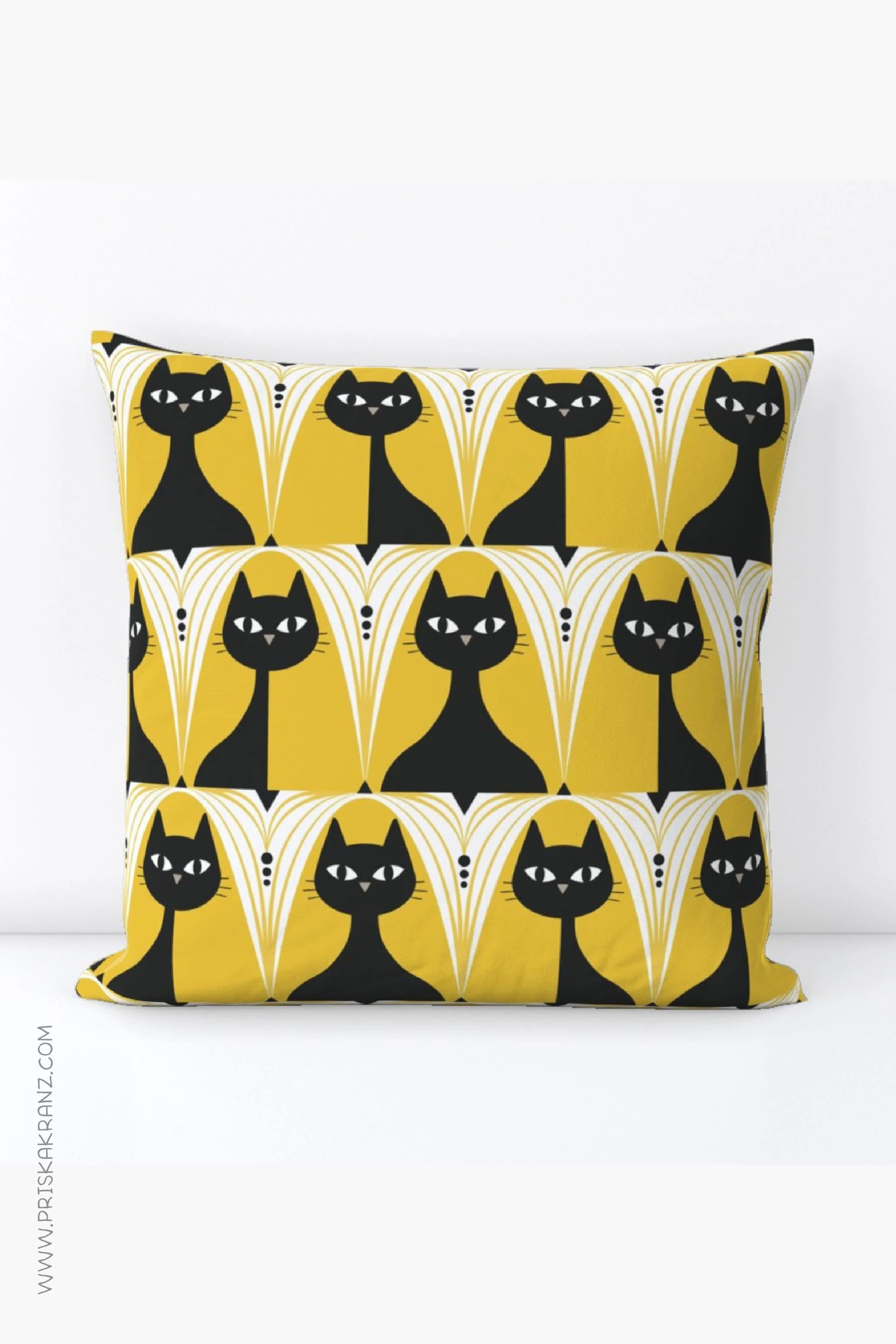 Pillow showcasing stylized black cats in an Art Deco style on a yellow background.