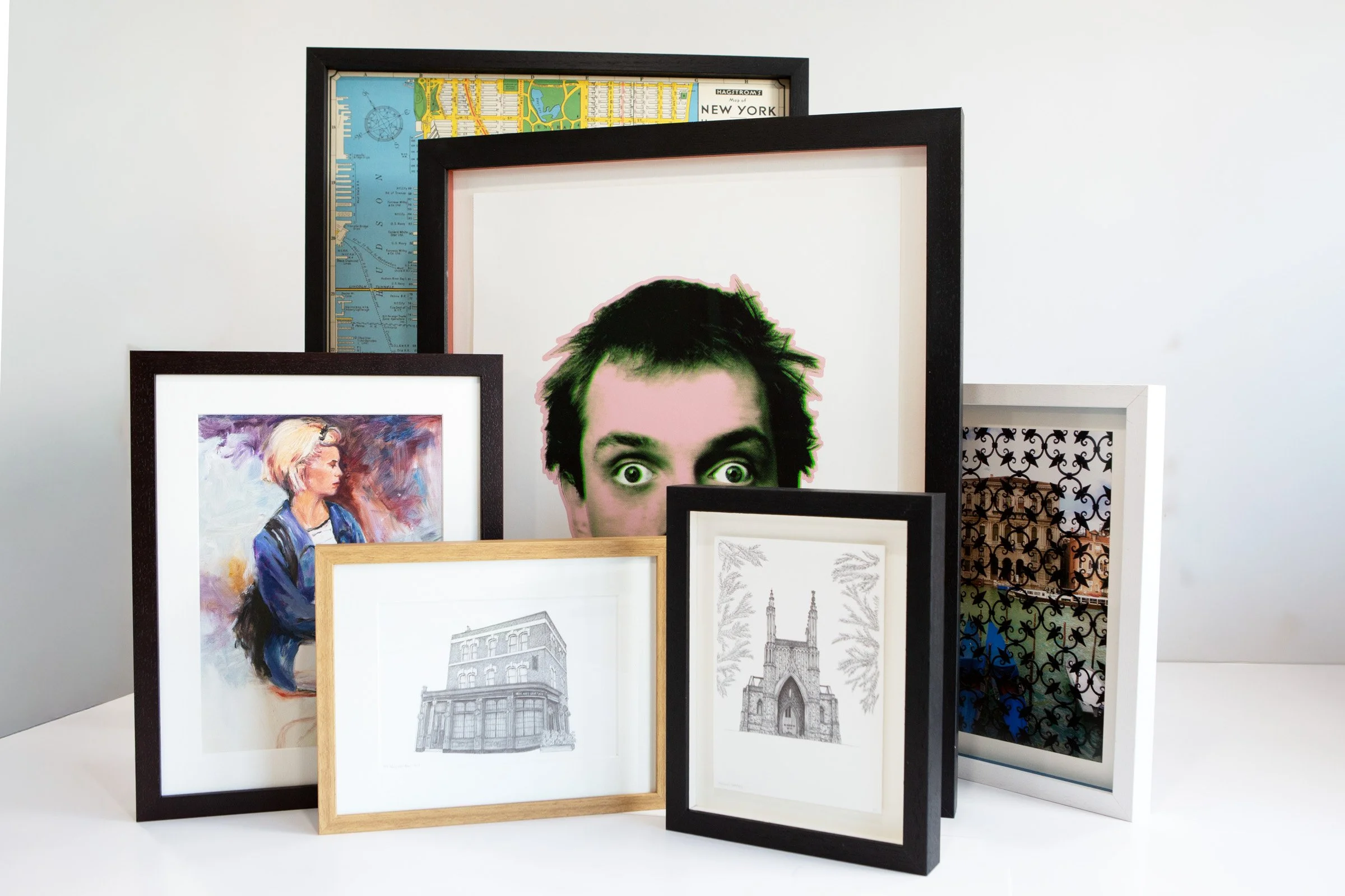Six examples of Essential picture framing by The Nunhead Framer in black, white, oak and wedge frames with window mount, float mount and shadow float mount options using coloured spacer