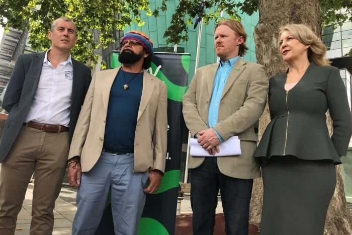 Photo:  Sea Shepherd Australia's Jeff Hansen, Mirning elder Bunna Lawrie, the Wilderness Society's Peter Owen and Holdfast Bay Mayor Amanda Wilson at the launch of the legal action. (ABC News: Stacey Lee)
