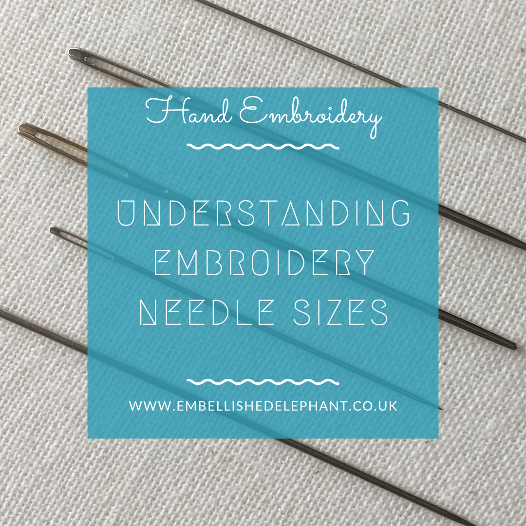An image of some embroidery needles laid on some fabric. Overlaid is a blue square with white text saying - hand embroidery, understanding embroidery needle sizes, www.embellishedelephant.co.uk