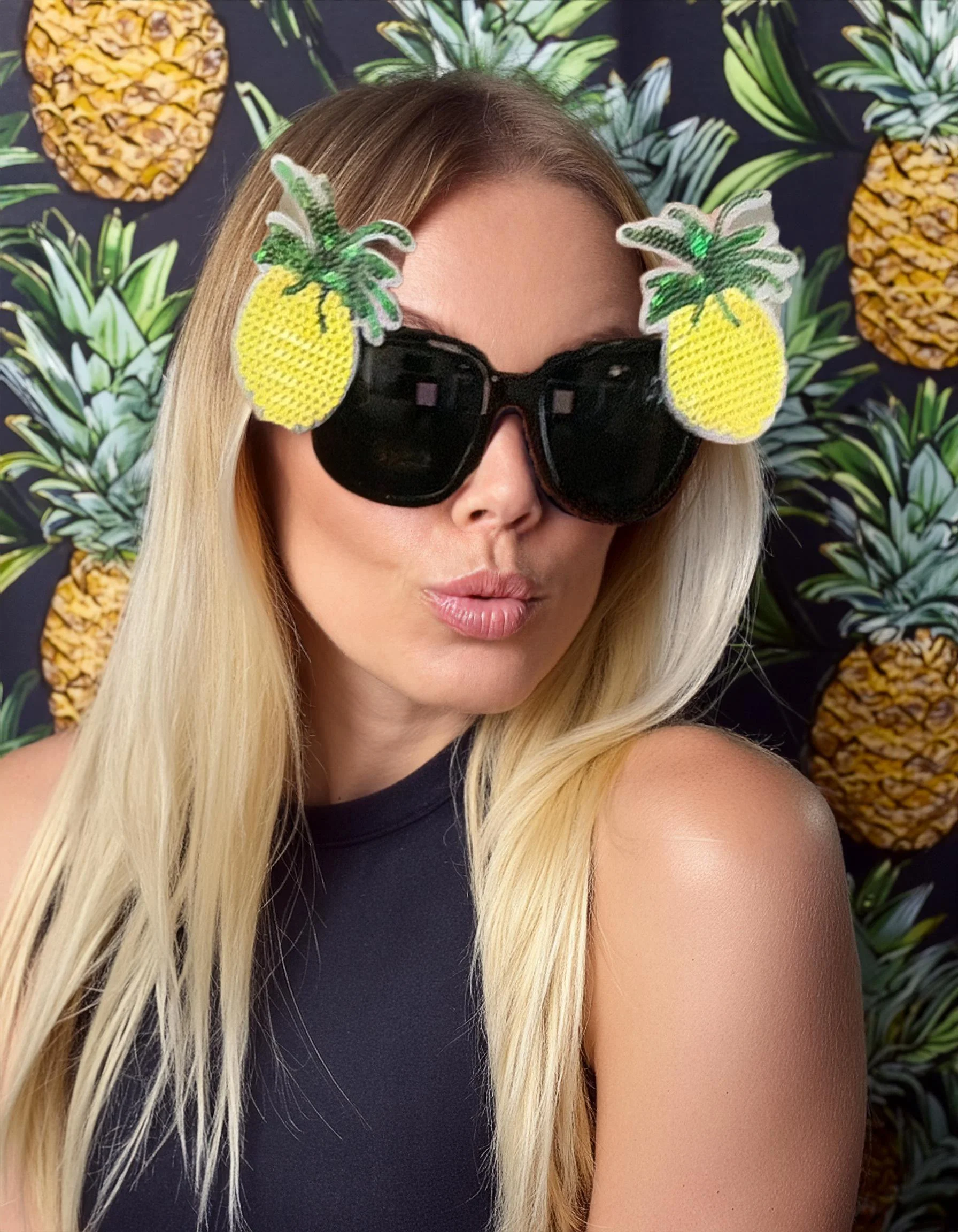 Firefly girl wearing glasses in a 80s pineapple backdrop 69602.jpg