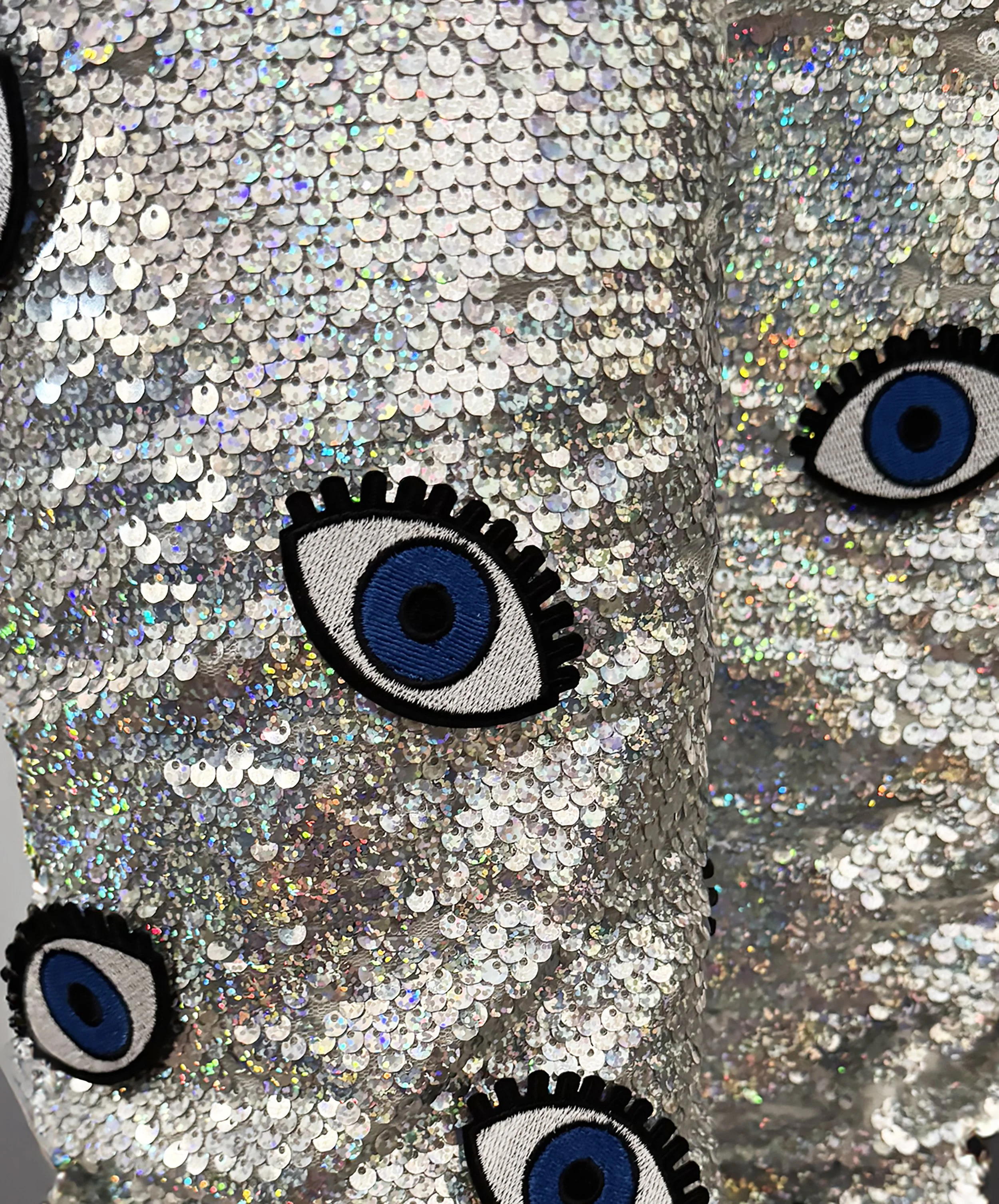 One-of-a-kind silver sequin boots embellished with embroidered evil eye patches, designed by artist Charity Huether. Mid-calf stiletto heel, size 8.5.