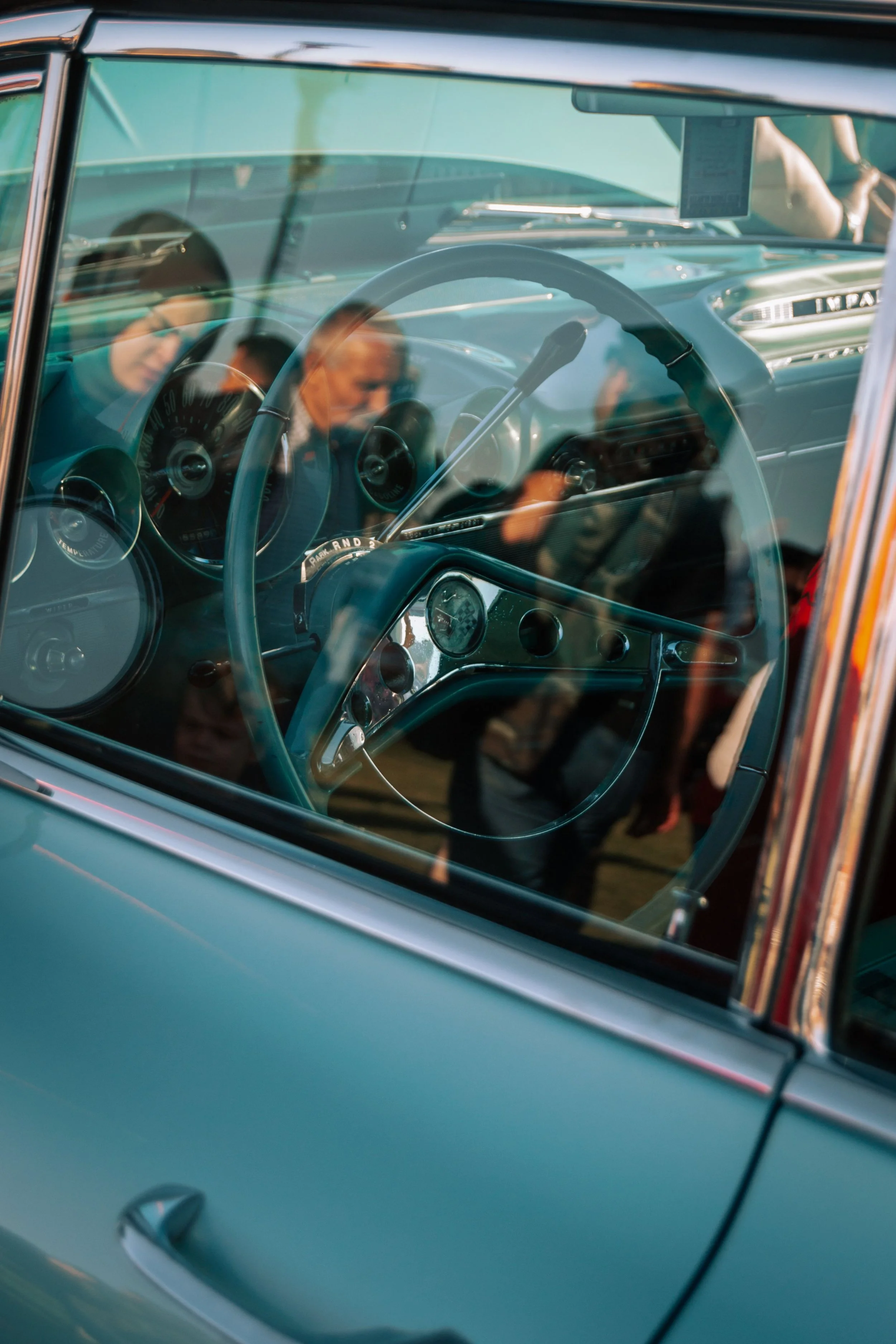 Interior view through a classic car window, representing the business vehicles photographers use to travel to client sessions and track deductible mileage.