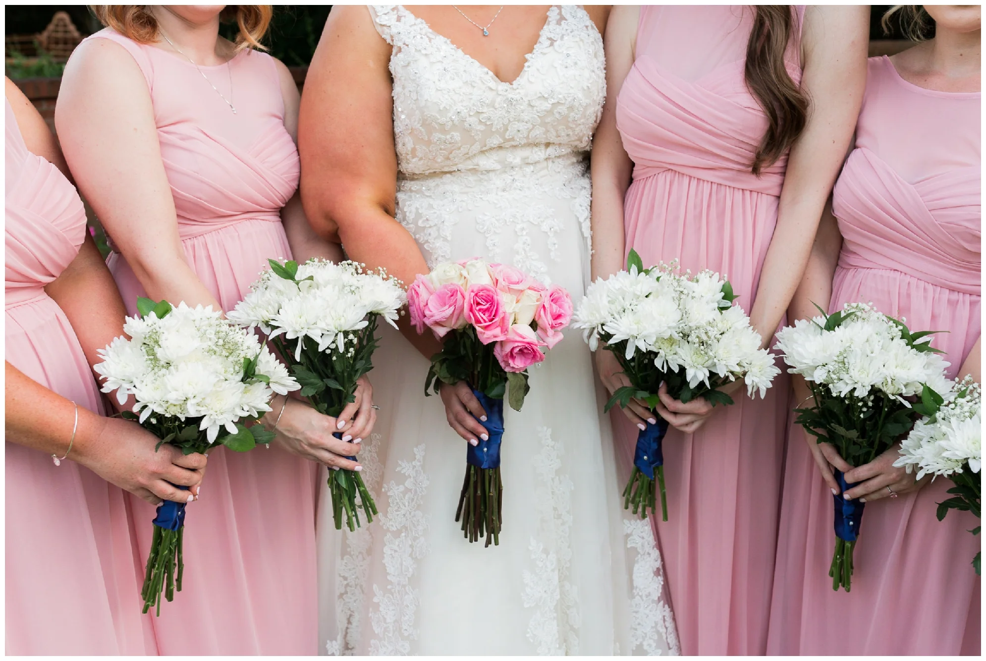 A beautiful navy and peach summer wedding at Quiet Waters Park in Annapolis, MD.