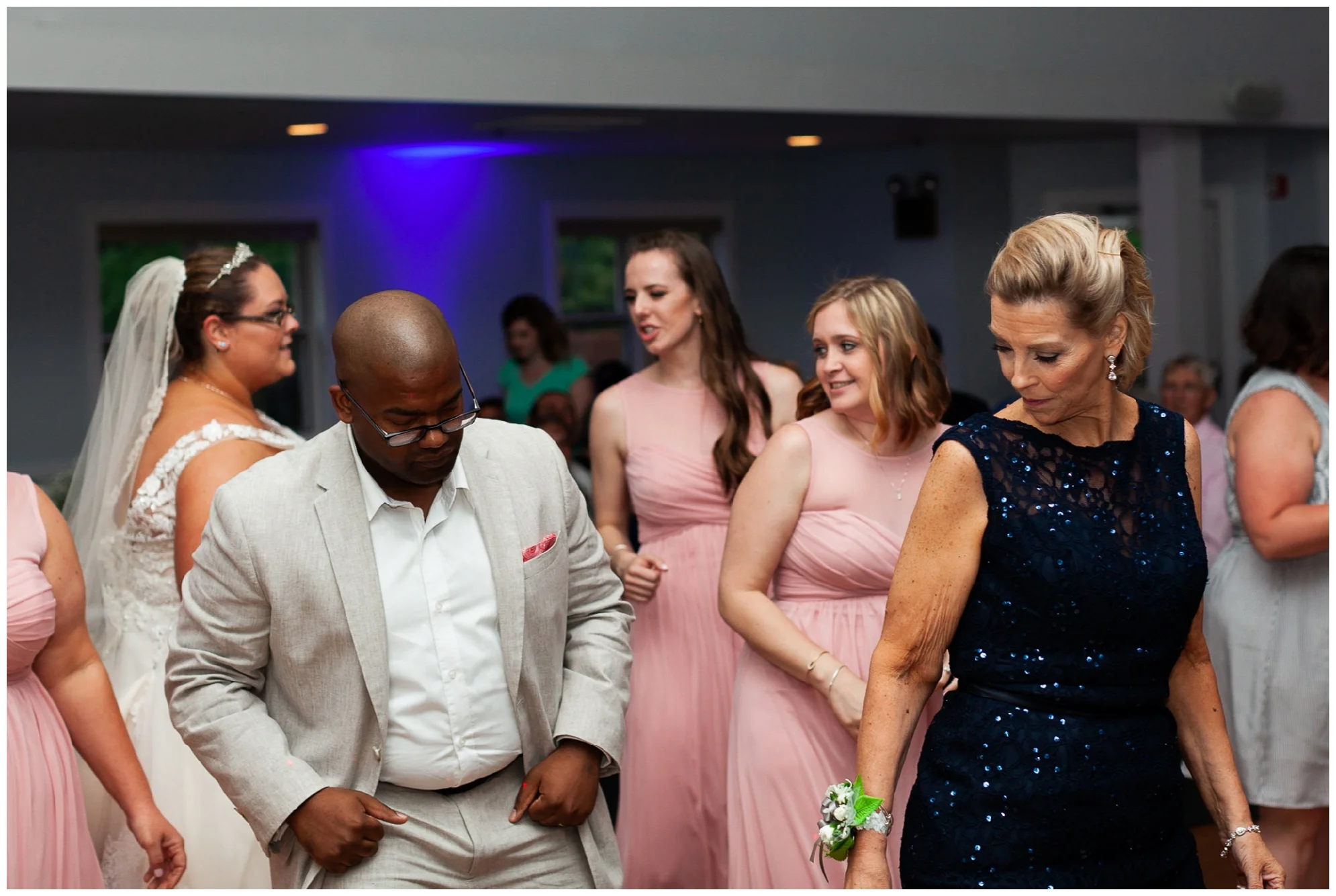 A beautiful navy and peach summer wedding at Quiet Waters Park in Annapolis, MD.