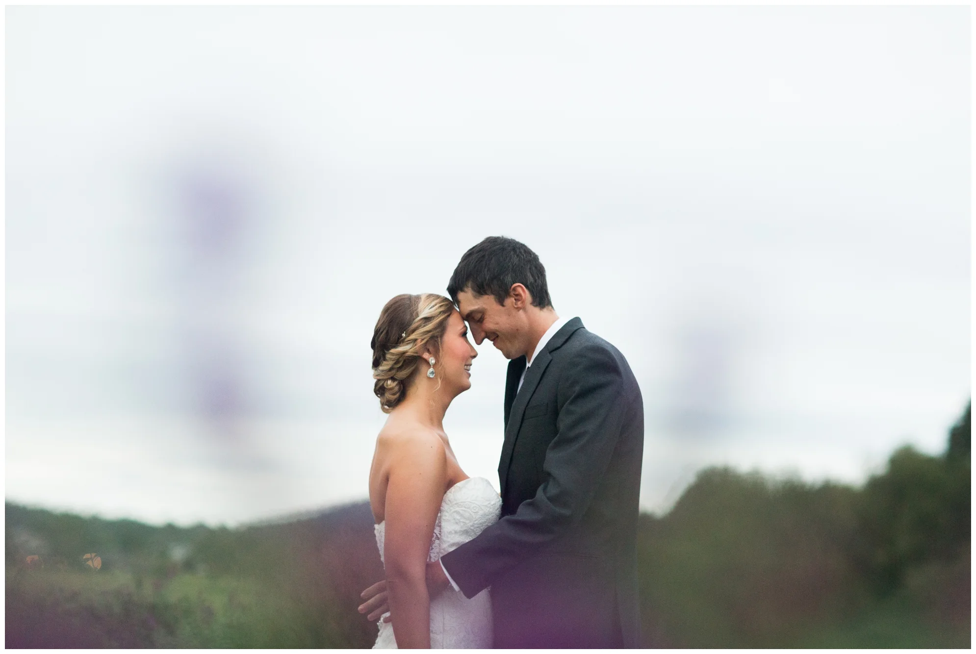 Rainy fall wedding featuring dusty blue bridesmaid dresses, bow ties and a cathedral veil at On Sunny Slope Farm in Harrisonburg, Virginia.