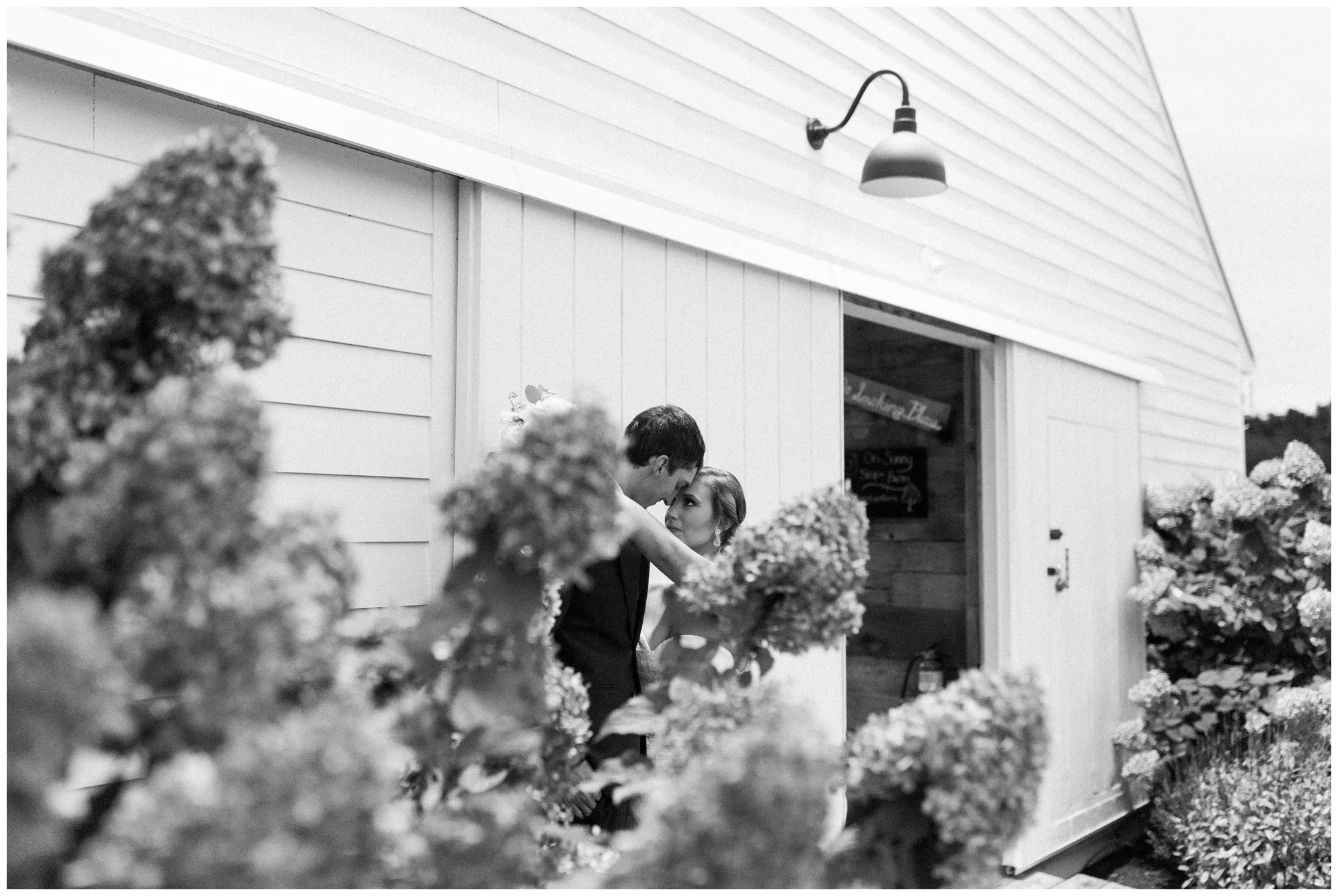 Rainy fall wedding featuring dusty blue bridesmaid dresses, bow ties and a cathedral veil at On Sunny Slope Farm in Harrisonburg, Virginia.