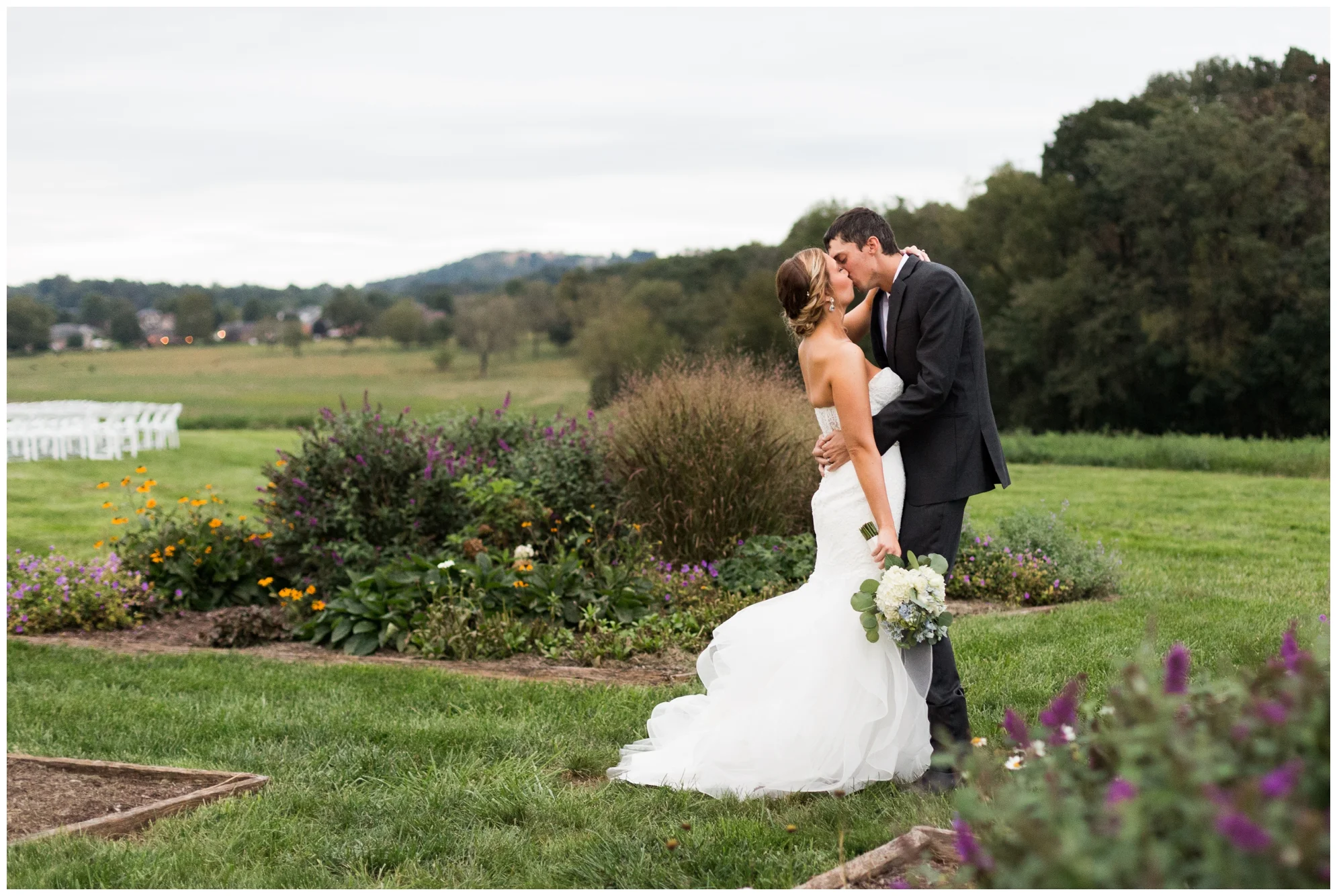 Rainy fall wedding featuring dusty blue bridesmaid dresses, bow ties and a cathedral veil at On Sunny Slope Farm in Harrisonburg, Virginia.