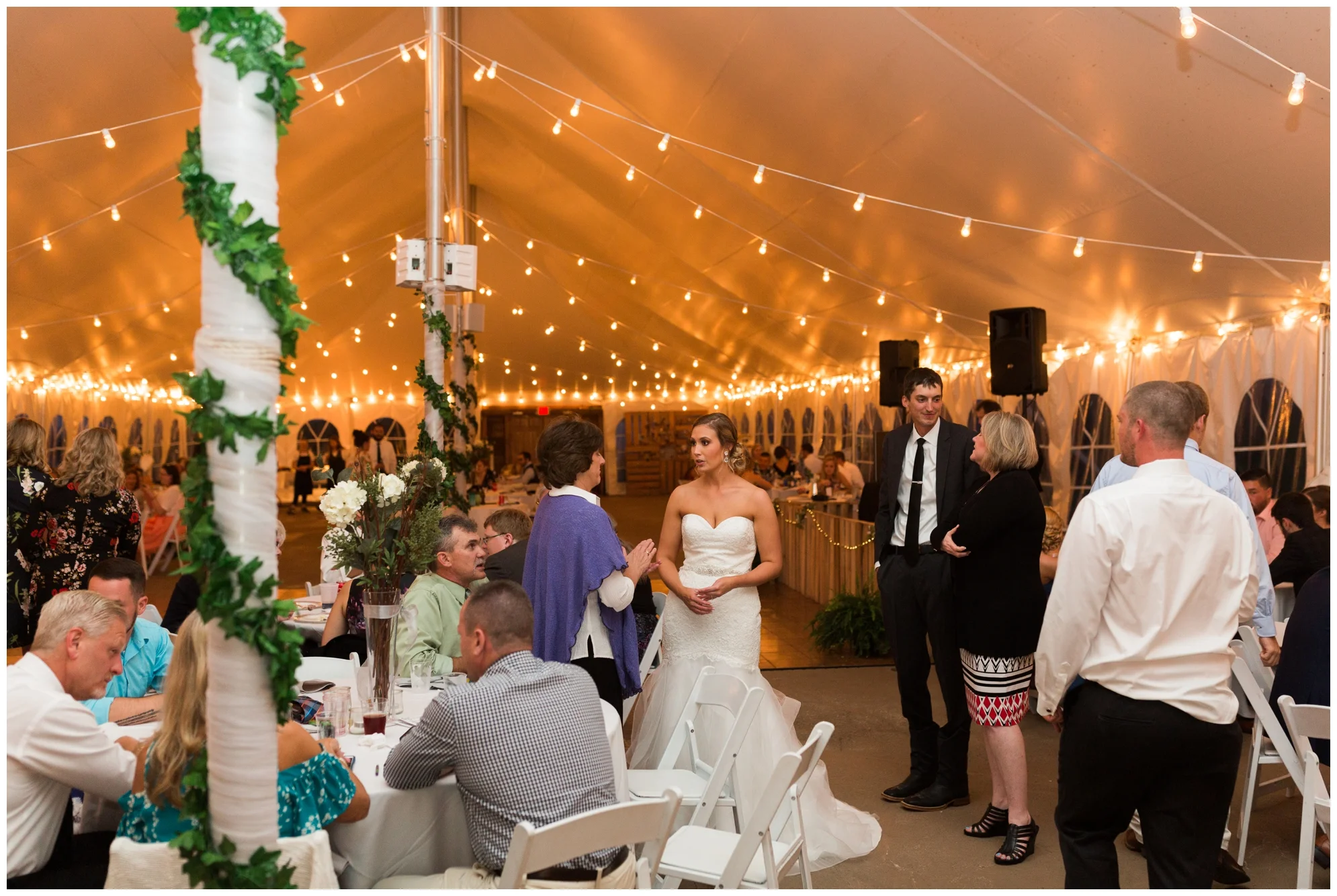Rainy fall wedding featuring dusty blue bridesmaid dresses, bow ties and a cathedral veil at On Sunny Slope Farm in Harrisonburg, Virginia.