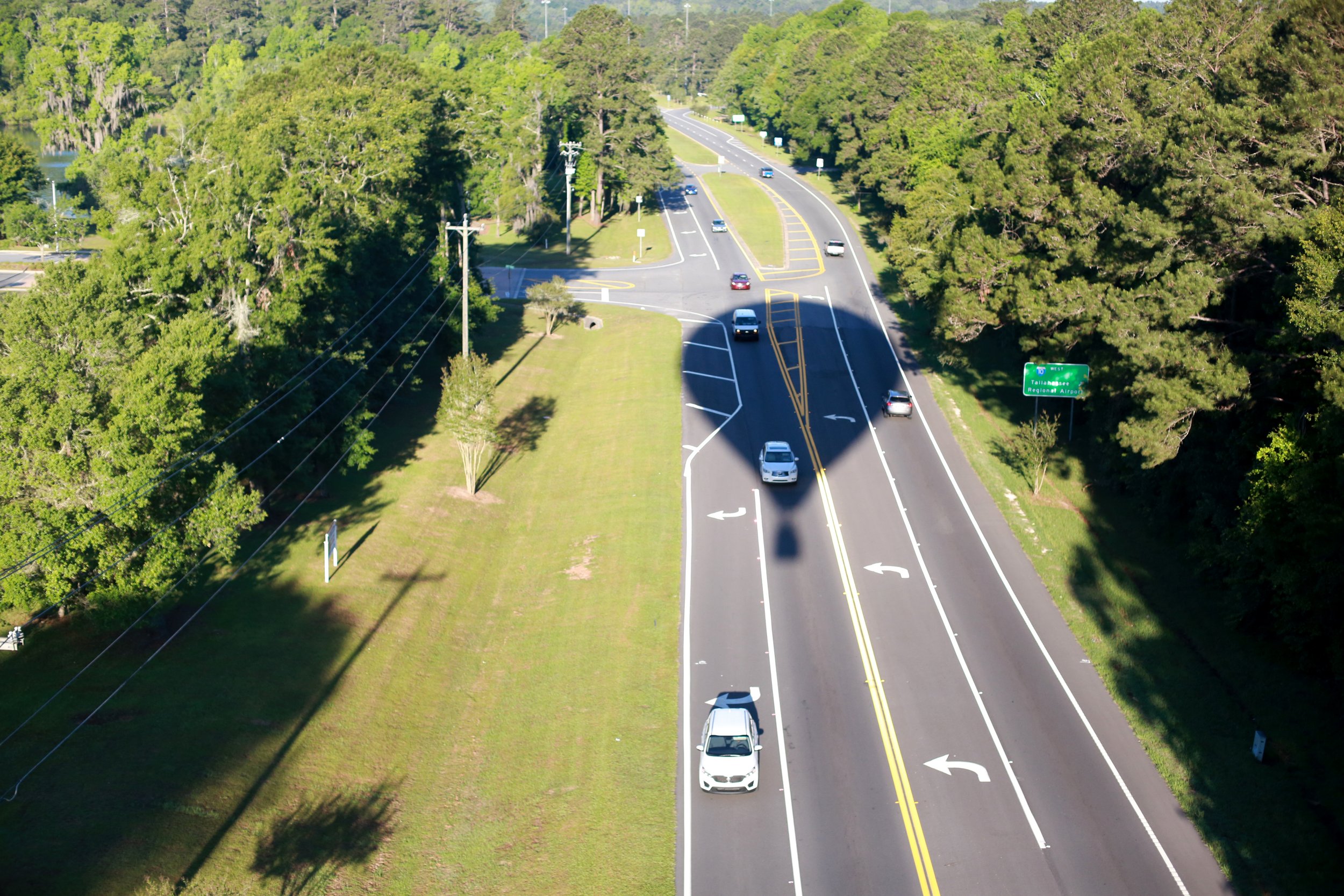  Tracer's shadow crosses Mahan Road in Tallahassee, Fla., as the balloon comes in for a landing in the grassy lot next to Ruby's Diner. Pilot Wendell Purvis got his first glimpse of his future career when a balloon unexpectedly landed in his back yar