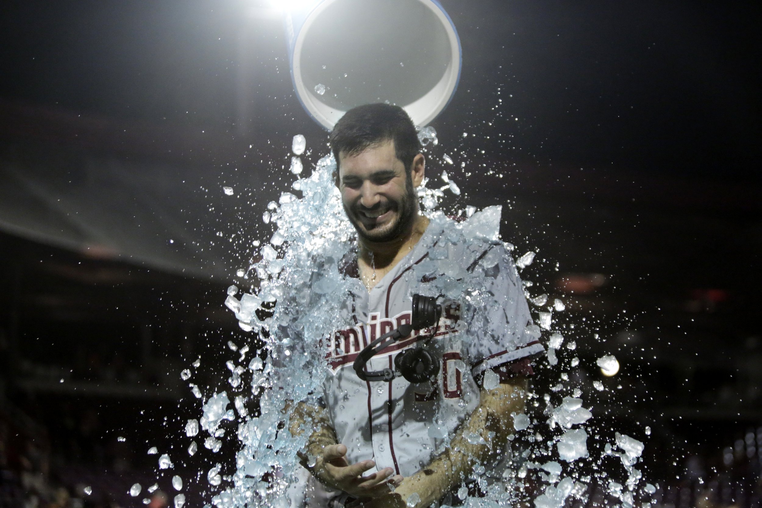  Florida State pitcher Will Zirzow gets doused by teammate Quincy Nieporte after FSU beat Auburn in the NCAA Tallahassee regionals at Dick Howser Stadium Monday, June 5, 2017. 