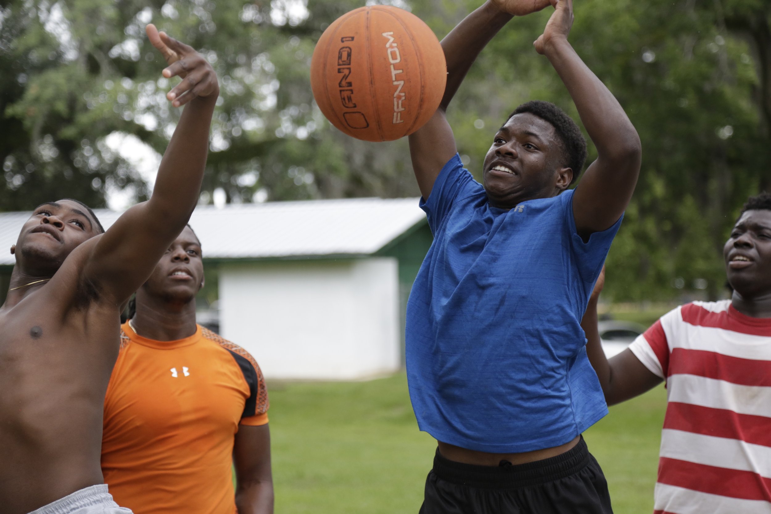  Jefferson County Middle/High School senior Kris Hawkins, center right, plays basketball with classmates on the courts at a public park in Monticello during his senior picnic May 22, 2017. 