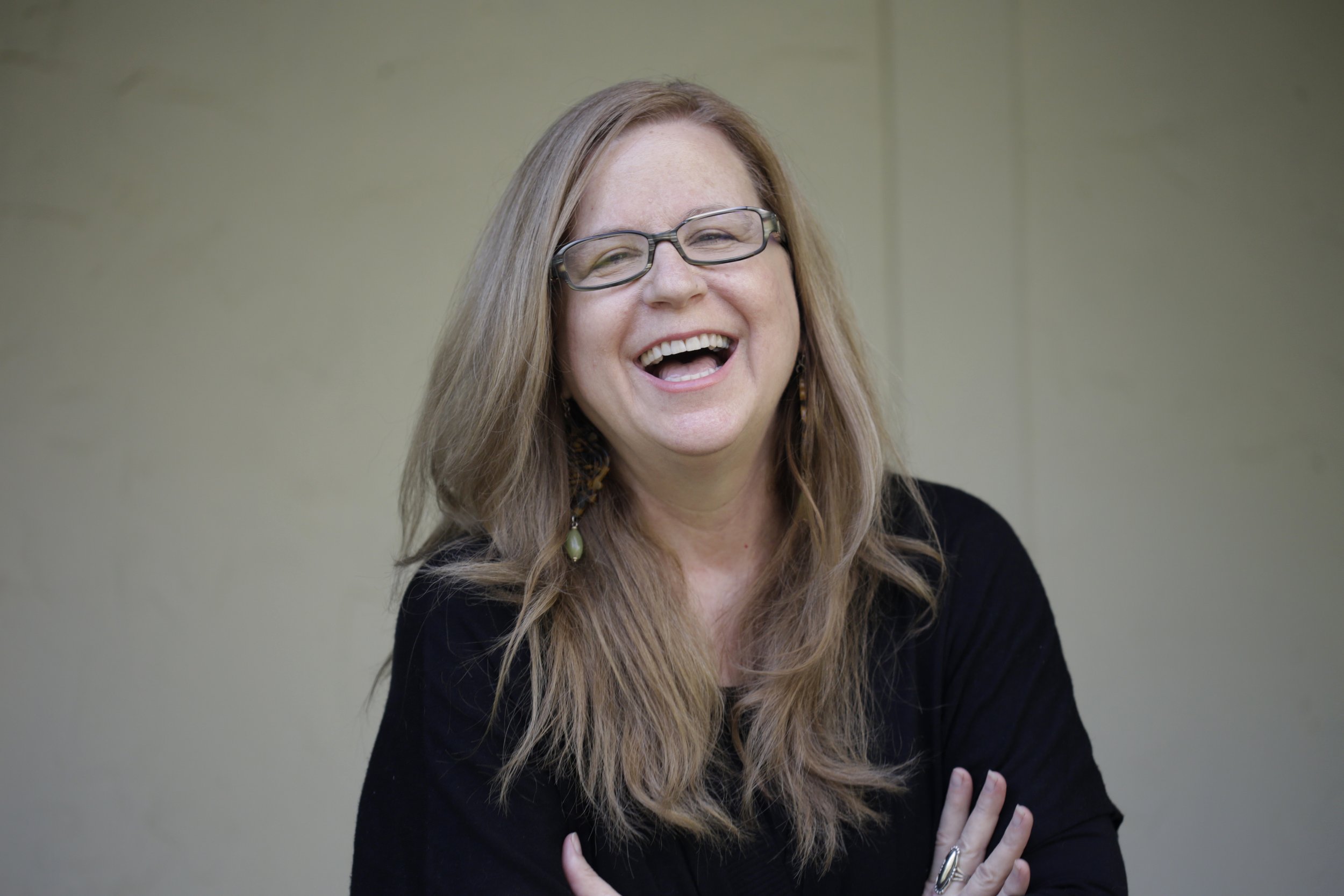  Liz Joyner, Executive director of The Village Square, takes a break from her work running the nonprofit devoted to civic dialogue to pose for a portrait in her home office March 20, 2017. 