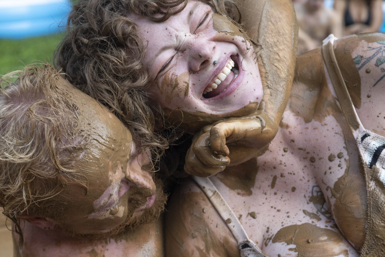  Two kiddie pools and a truckload of pulverized earth from the speedway transform a Bloomington, Ind. backyard into a mud wrestling arena where participants in the Dirty Boi Pit Smash face off to raise  funds for gender affirming surgeries.  