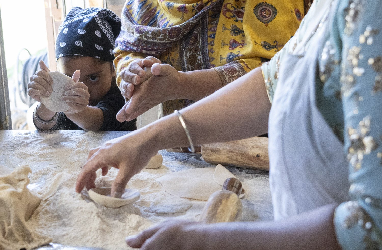  Volunteers prepare chapatis for the langar, or community meal, following services Sunday, Nov. 5, 2023, at the Sikh Satsang Gurdwara in Indianapolis. The meal is vegetarian and free to anyone, regardless of faith. 