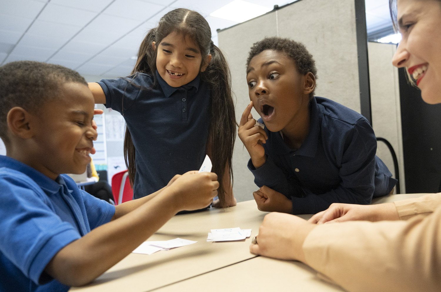  Second-graders Ivory Donson, left to right, Daniela Nieves and Keon Viverette play a reading game with tutor Grace Martin during a Circle City Readers tutoring session Thursday, Nov. 9, 2023, at Vision Academy at Riverside in Indianapolis. The word 