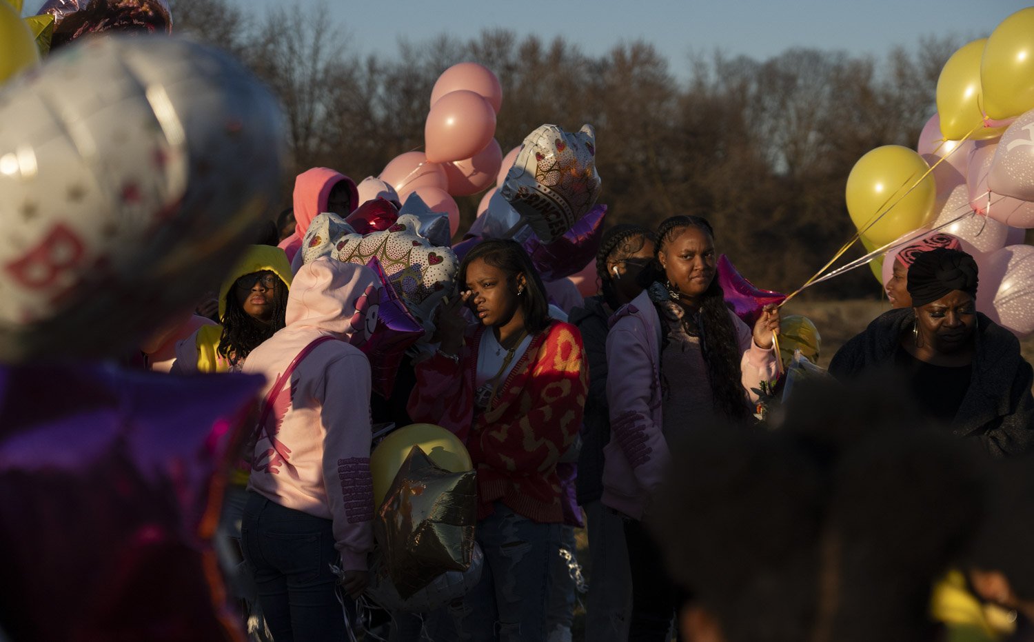  Friends and family celebrate Serenity Wilson’s seventeenth birthday Tuesday, Dec. 12, 2023, beside her grave in Indianapolis. The straight A student at Lawrence North High School was killed when shooting broke out at a block party in July. 
