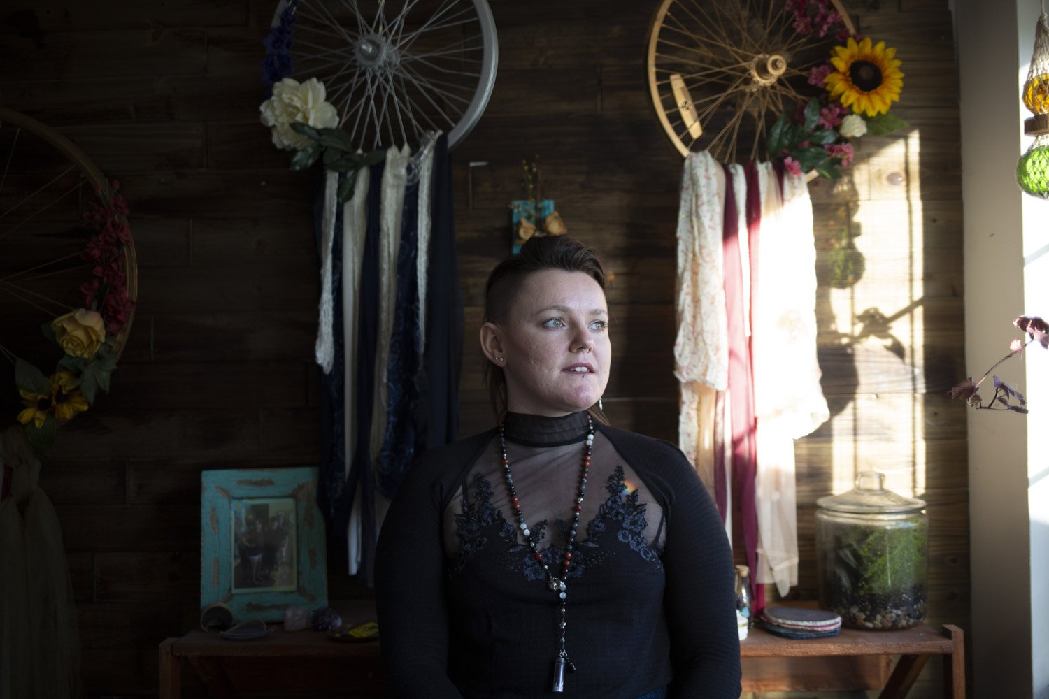  Kara Bookwalter, founding member of the Bloomington With Collective, poses in her home Feb. 26, 2022. "We are a group of friends and non-denominational witches,” she says of the group. “We are not a coven.”  