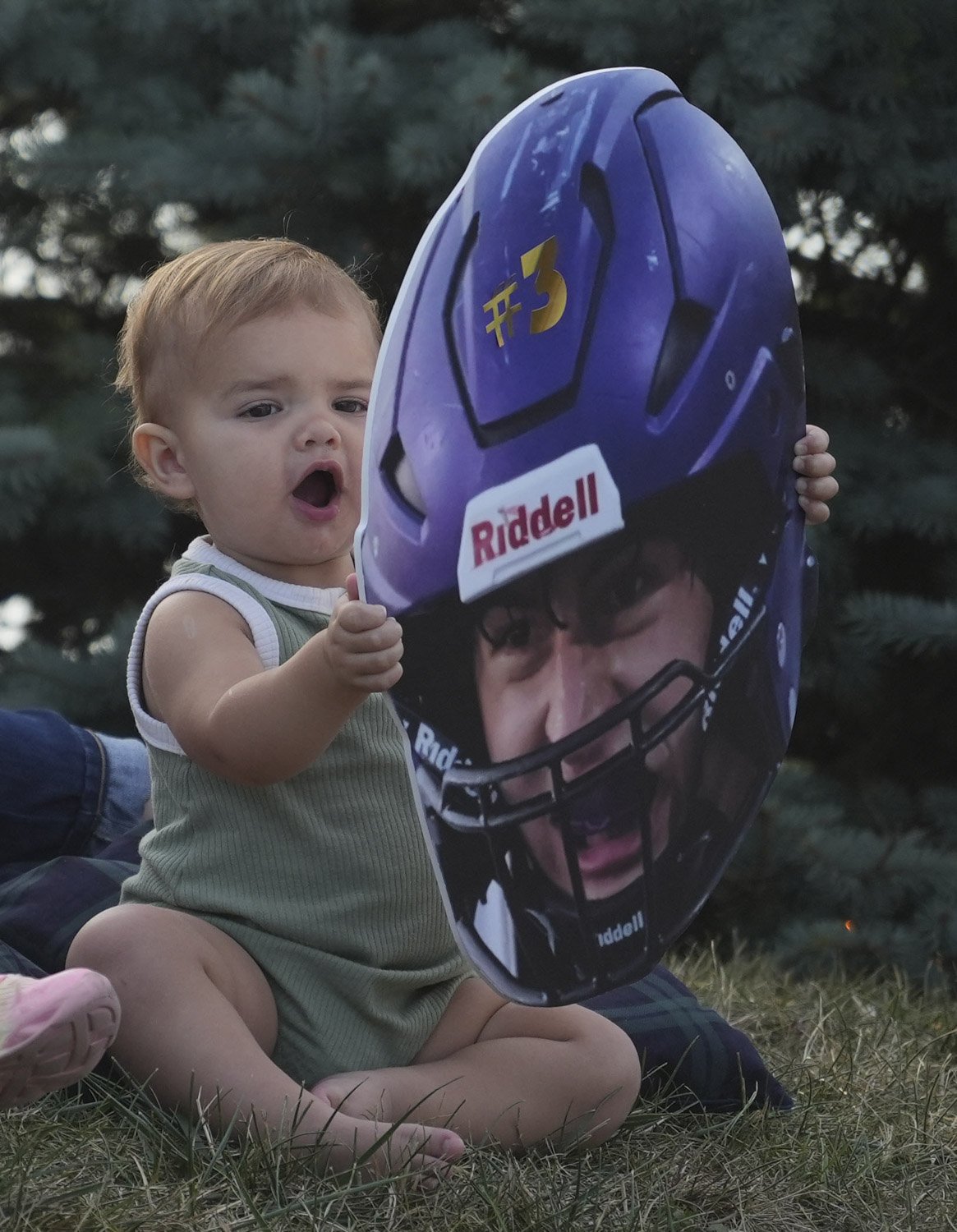  Karter Koehne, 15 mo., plays with a cardboard cutout of family friend Chase Reed’s face before Reed and the Guerin Catholic Golden Eagles take on the Bishop Chatard Trojans on Friday, Sept. 22, 2023, at Guerin Catholic High School in Nobelsville, In