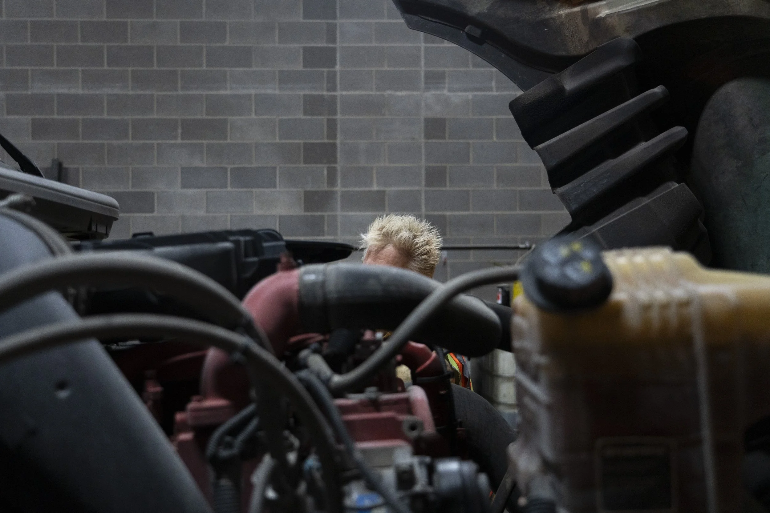  J.J.Pearson performs the pre-trip check on his truck Thursday, Nov. 2, 2023 at the Thrift Trucking garage in Indianapolis before making his nightly run to the Chicago area. 