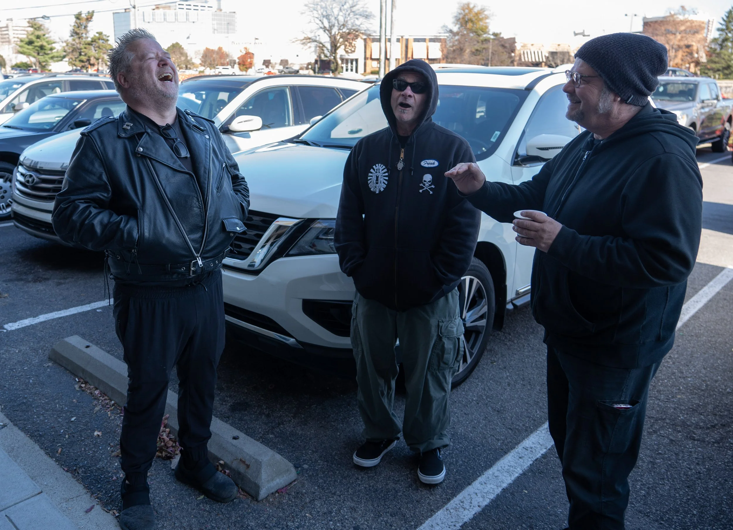  J.J.Pearson, left, jokes with old friends Glenn and Gary Labita outside Ruth’s cafe in Indianapolis on Sunday, Nov. 12, 2023. The three are members of “the council,” a group of old guard punks who eat brunch together every Sunday at the Castleton ca