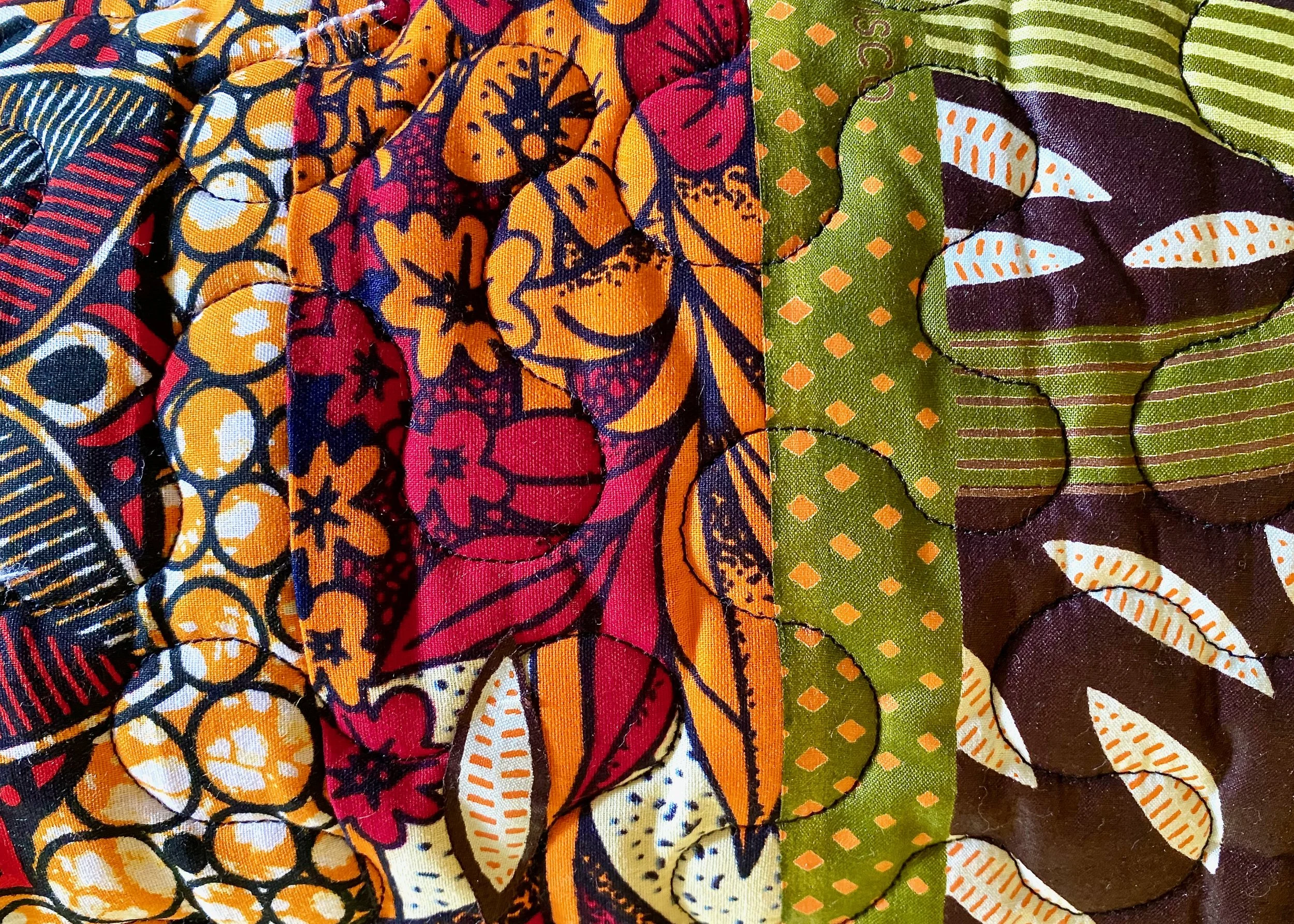 African Fabrics Collage with Green Edge.jpeg