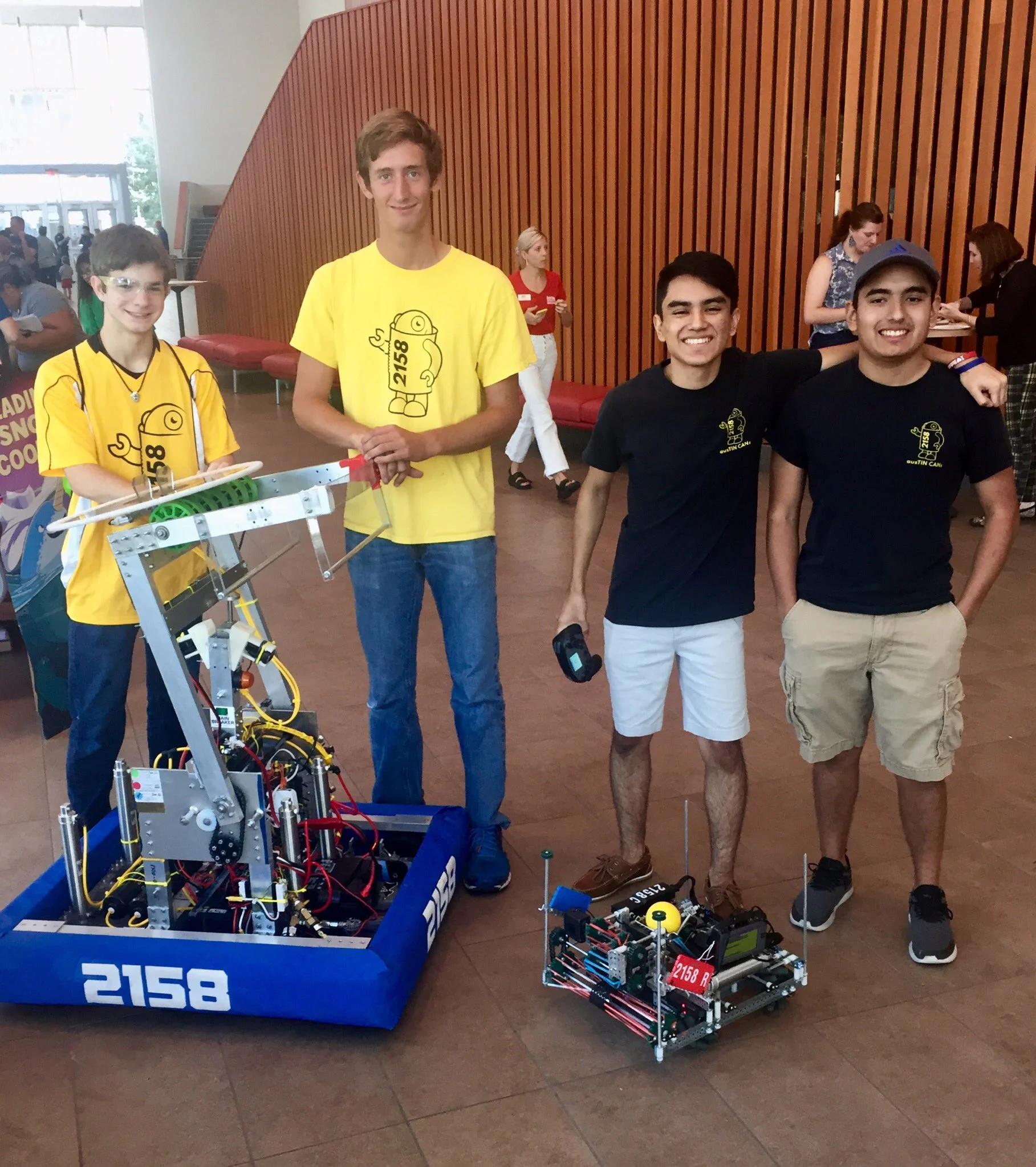 Will, David, Mauricio, and Eric demonstrate the FRC and VEX robots. Fun Fact: Each of these bots appeared in their respective World Tournaments in 2019!