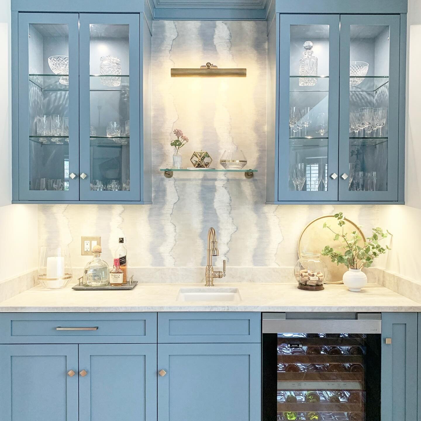 Happy #winedownwednesday however you celebrate. 🥂 😉
My clients and I chose a playful blue for the #wetbar space just off their white kitchen. 
Contractor: @s.l.wilhelm 
Paint color: @sherwinwilliams Secret Cove

#homebar #bluecabinetry #coffeebar #