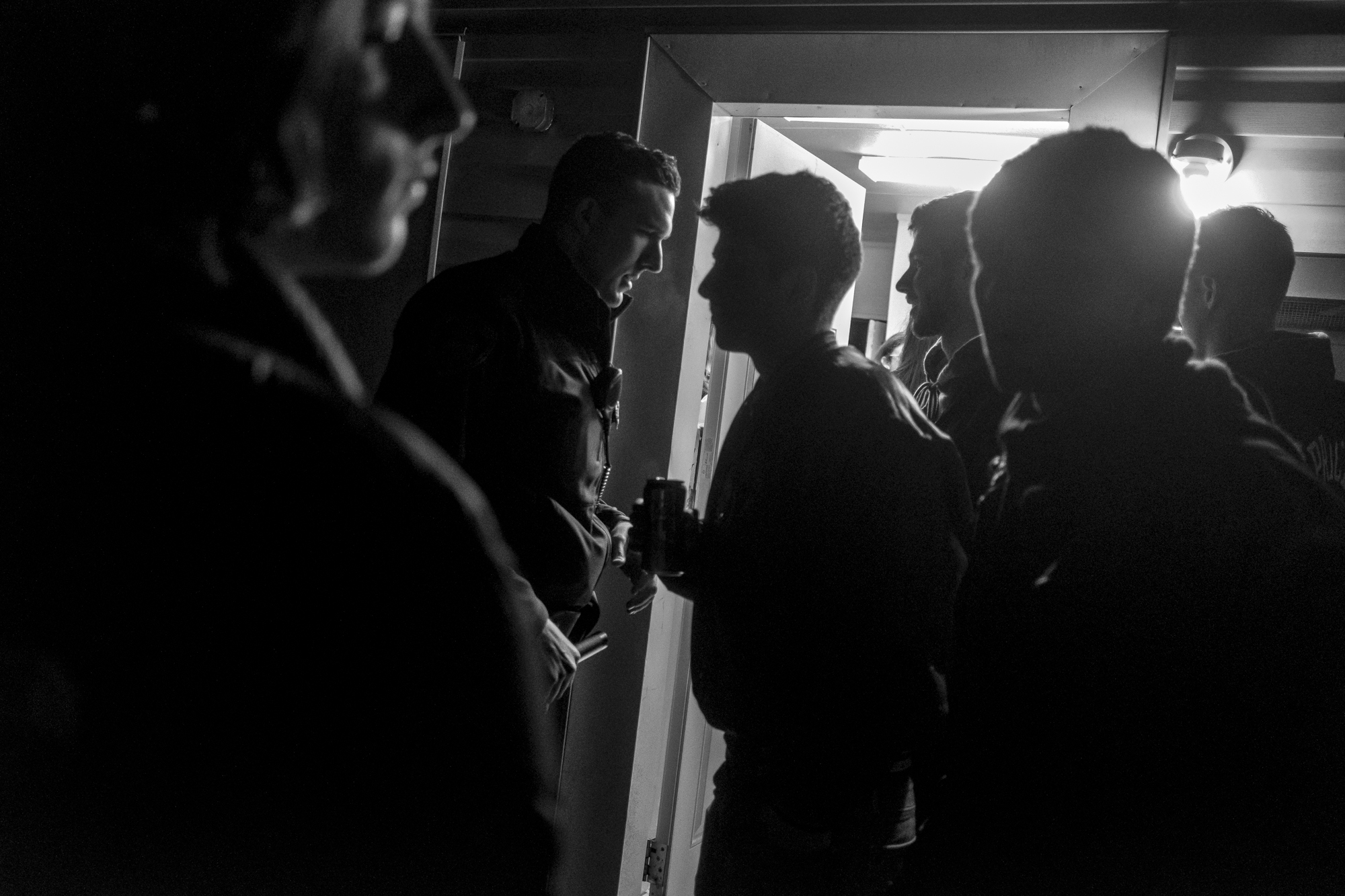 An Athens City Police Officer begins to shut down a house party during Congo Fest at Ohio, University.