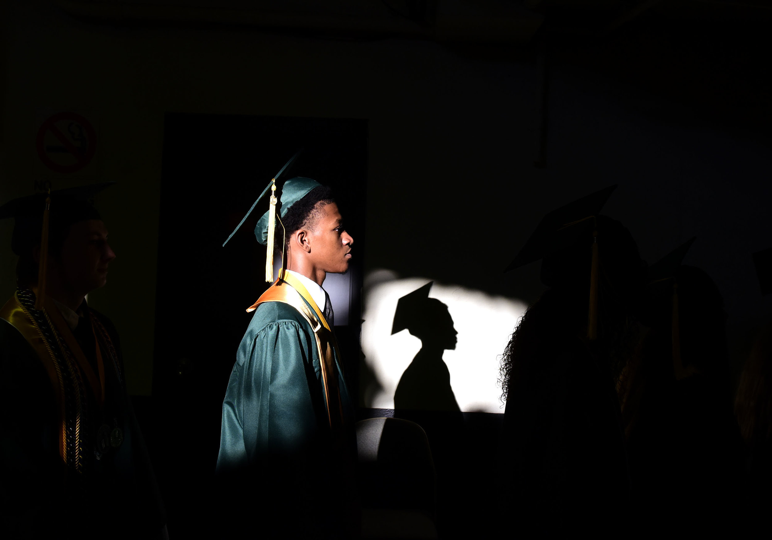  A student walks into the Hampton Coliseum as they began the graduation ceremony for the class of 2019 at Kecoughtan High School. 