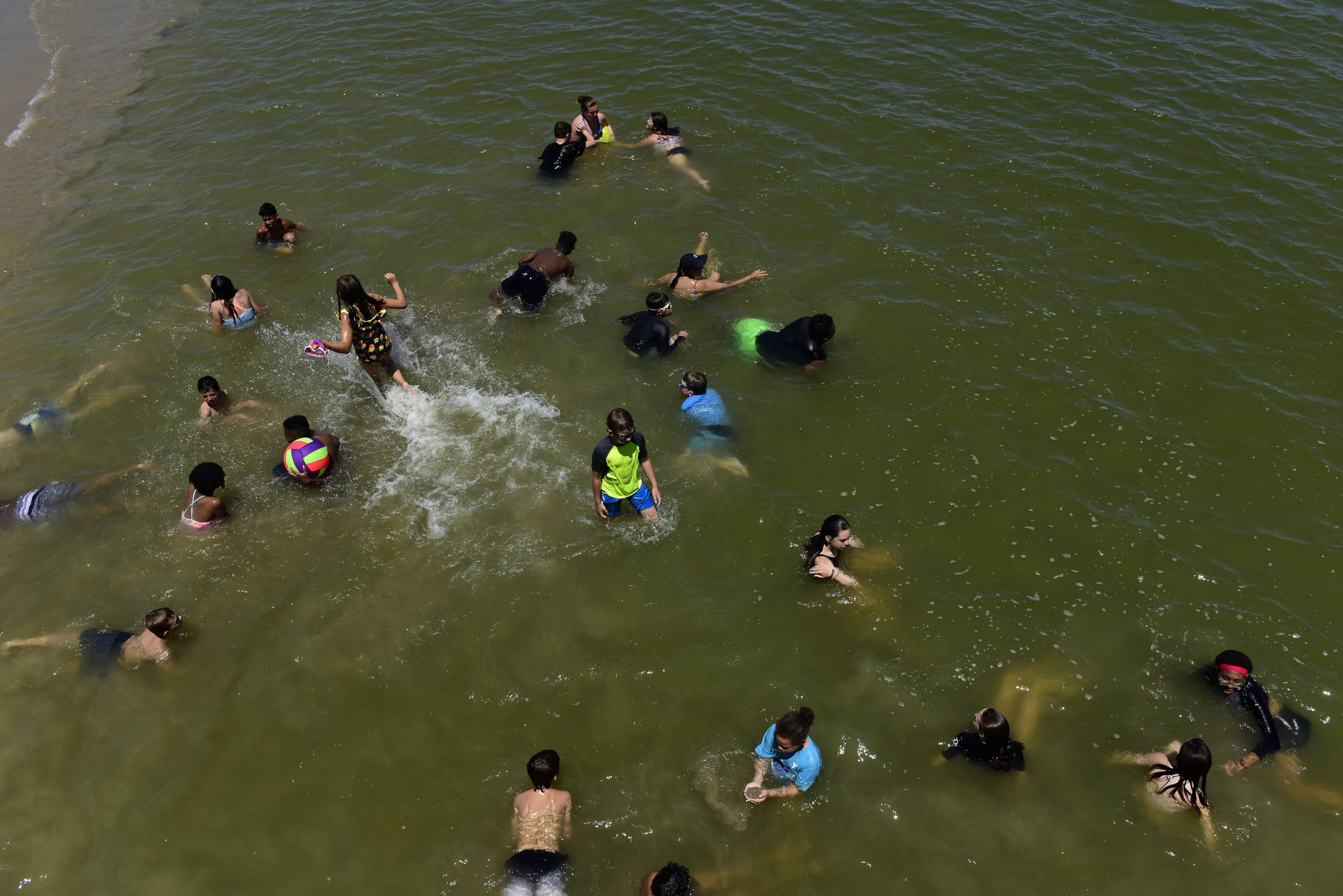  Kids cool off at Buckroe Beach after a hot day on Monday, July 15, 2019. 