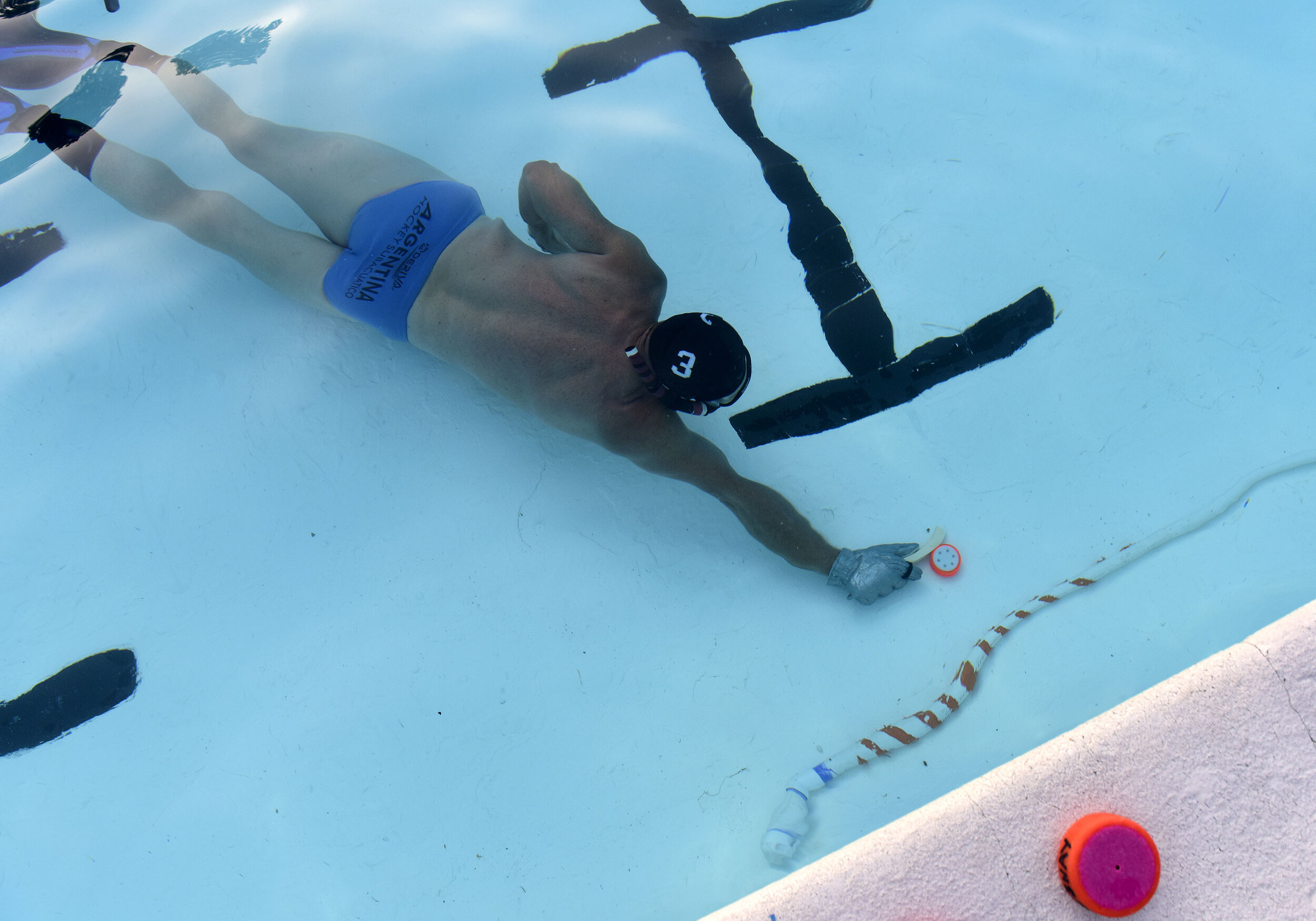  Pat Hanrahan goes to score a goal during an underwater hockey match at the Hampton Pool Association on Monday, August 12, 2019. Underwater Hockey is a co-ed, non-contact, water sport played on the bottom of the pool where players wear fins, for spee