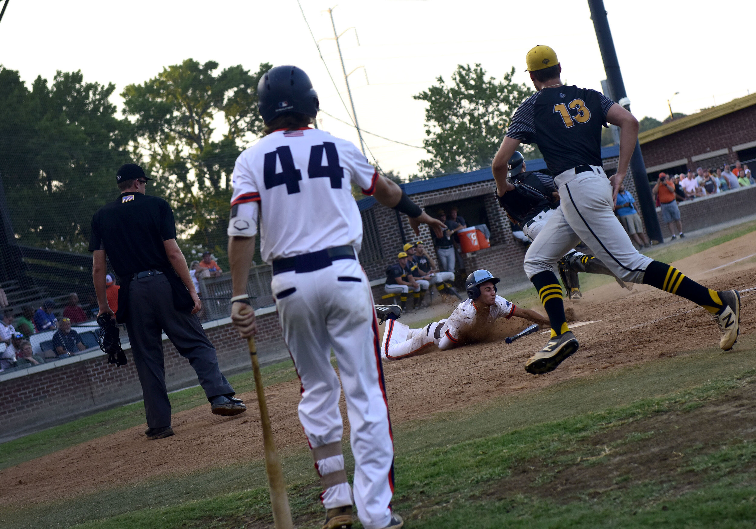  Nicolas Gonzalez slides in to home plate to score a run during game against the Denton Steamers at War Memorial Stadium on Monday, July, 29, 2019. 