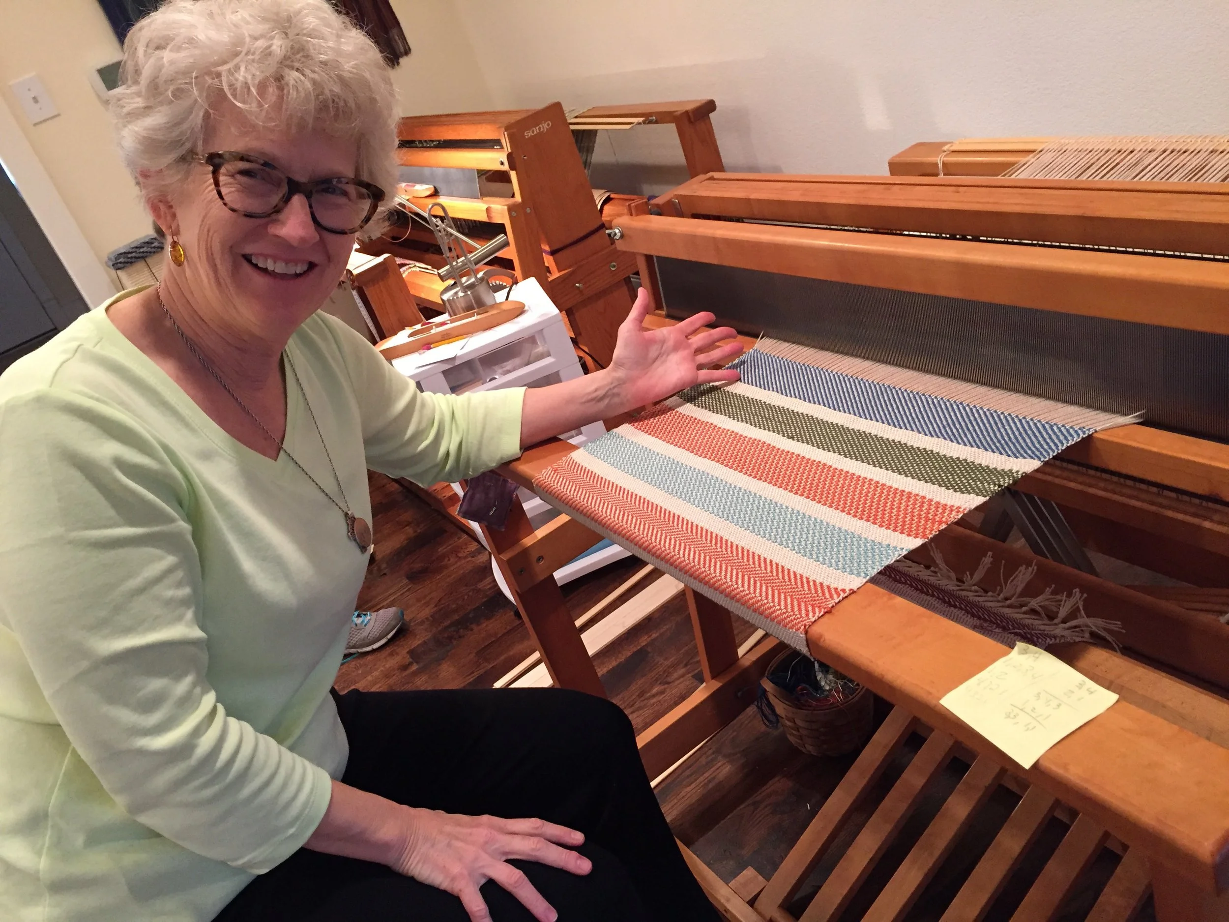 Student and her first floor loom project!