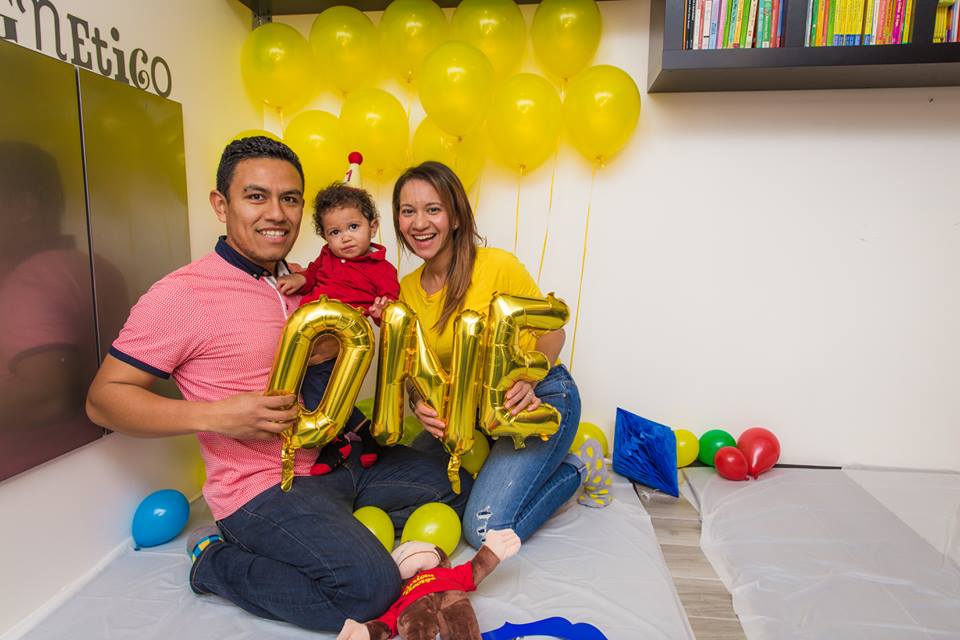 Family poses for picture for one year old birthday party celebration. (Copy)